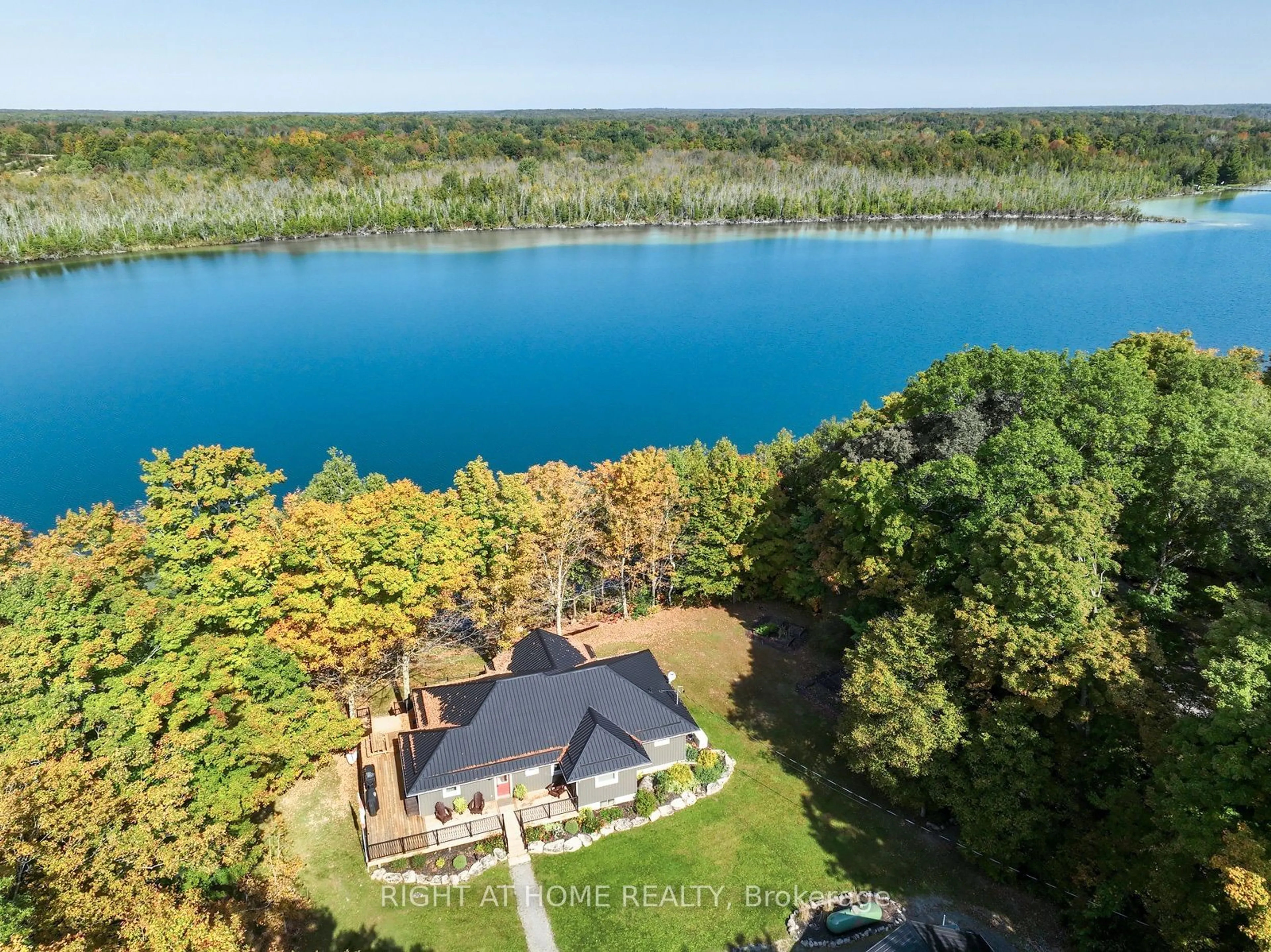 A pic from outside/outdoor area/front of a property/back of a property/a pic from drone, water/lake/river/ocean view for 98 Cottage Lane, Greater Napanee Ontario K0K 2L0