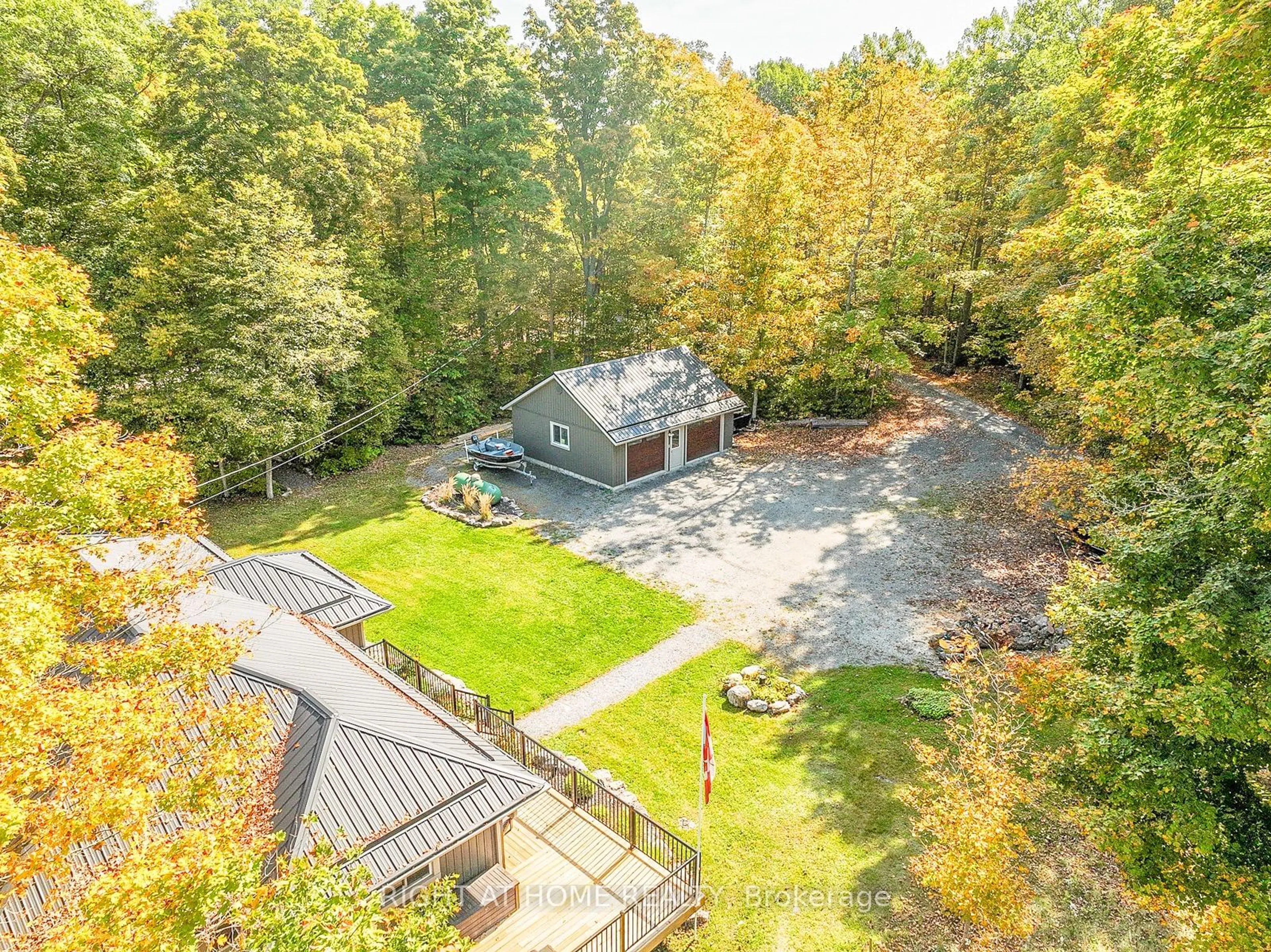 A pic from outside/outdoor area/front of a property/back of a property/a pic from drone, forest/trees view for 98 Cottage Lane, Greater Napanee Ontario K0K 2L0