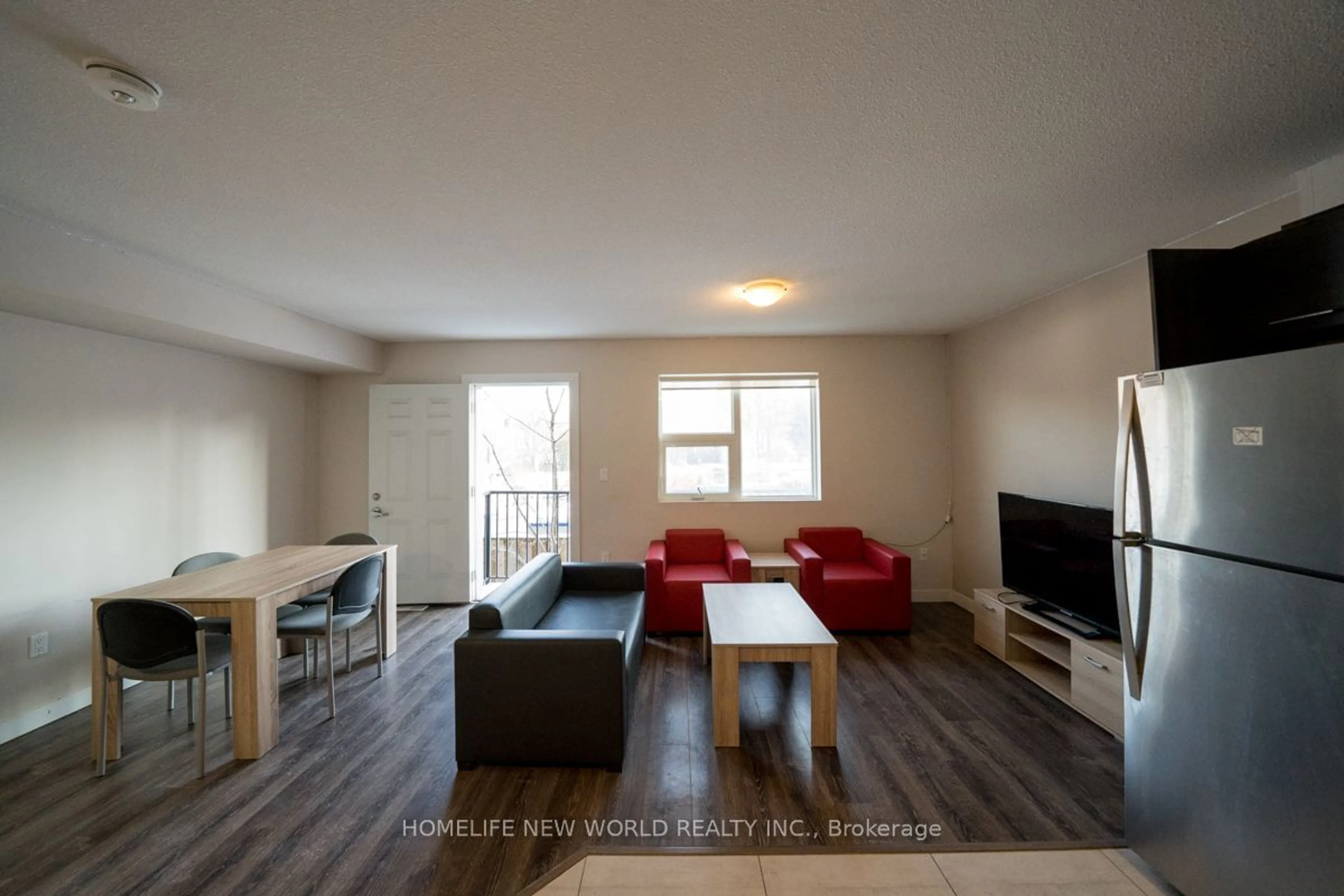 Living room with furniture, wood/laminate floor for 288 Albert St #116, Waterloo Ontario N2L 0G9