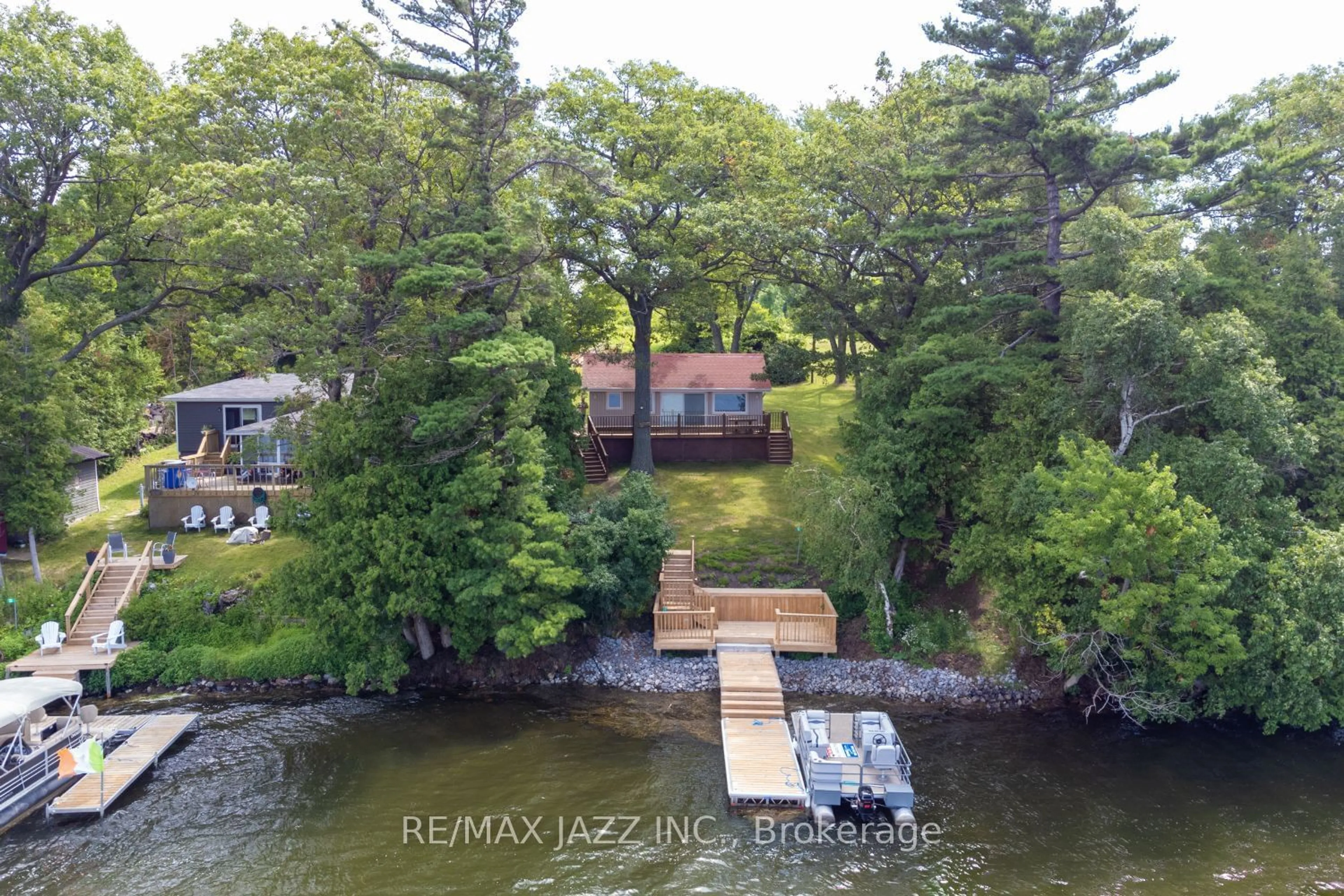 A pic from outside/outdoor area/front of a property/back of a property/a pic from drone, water/lake/river/ocean view for 52 Cow Island, Otonabee-South Monaghan Ontario K0L 1B0