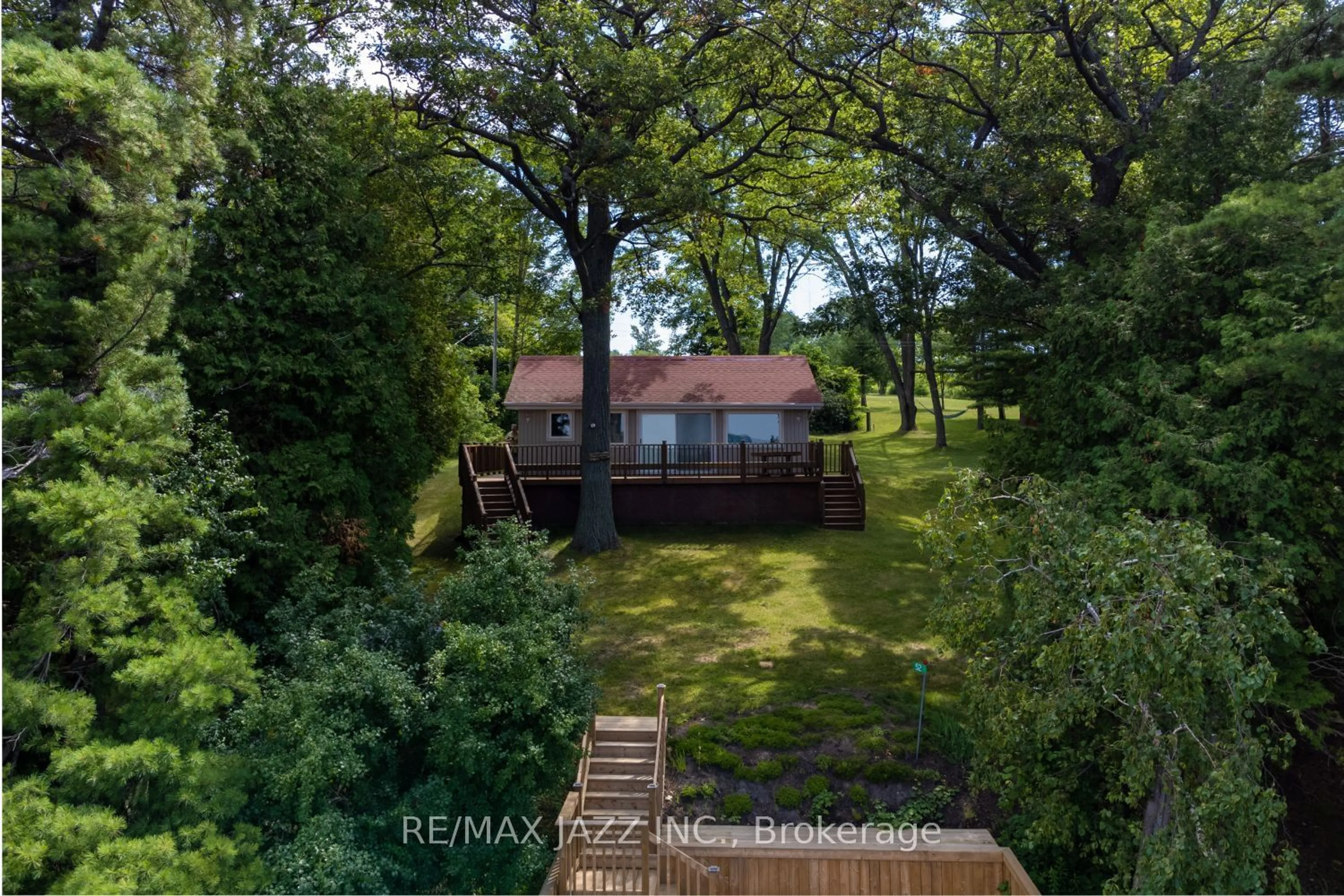 A pic from outside/outdoor area/front of a property/back of a property/a pic from drone, water/lake/river/ocean view for 52 Cow Island, Otonabee-South Monaghan Ontario K0L 1B0