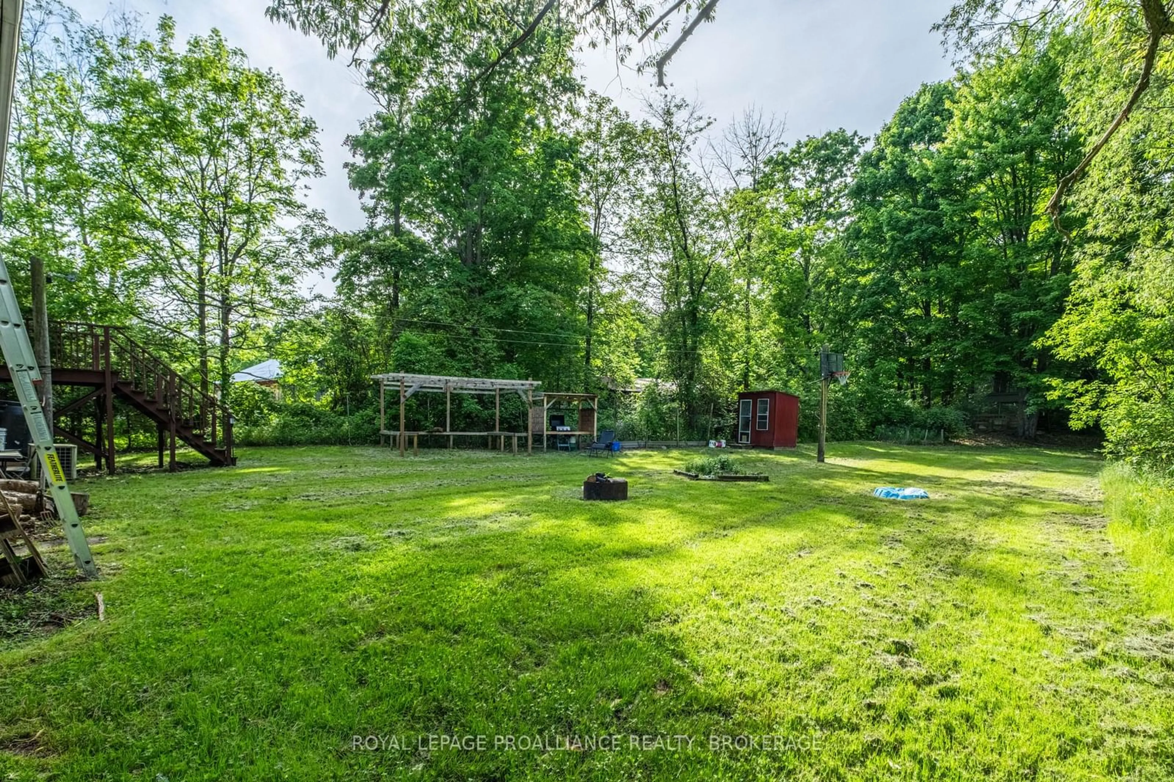 A pic from outside/outdoor area/front of a property/back of a property/a pic from drone, forest/trees view for 32 Old River Rd, Leeds and the Thousand Islands Ontario K0E 1R0