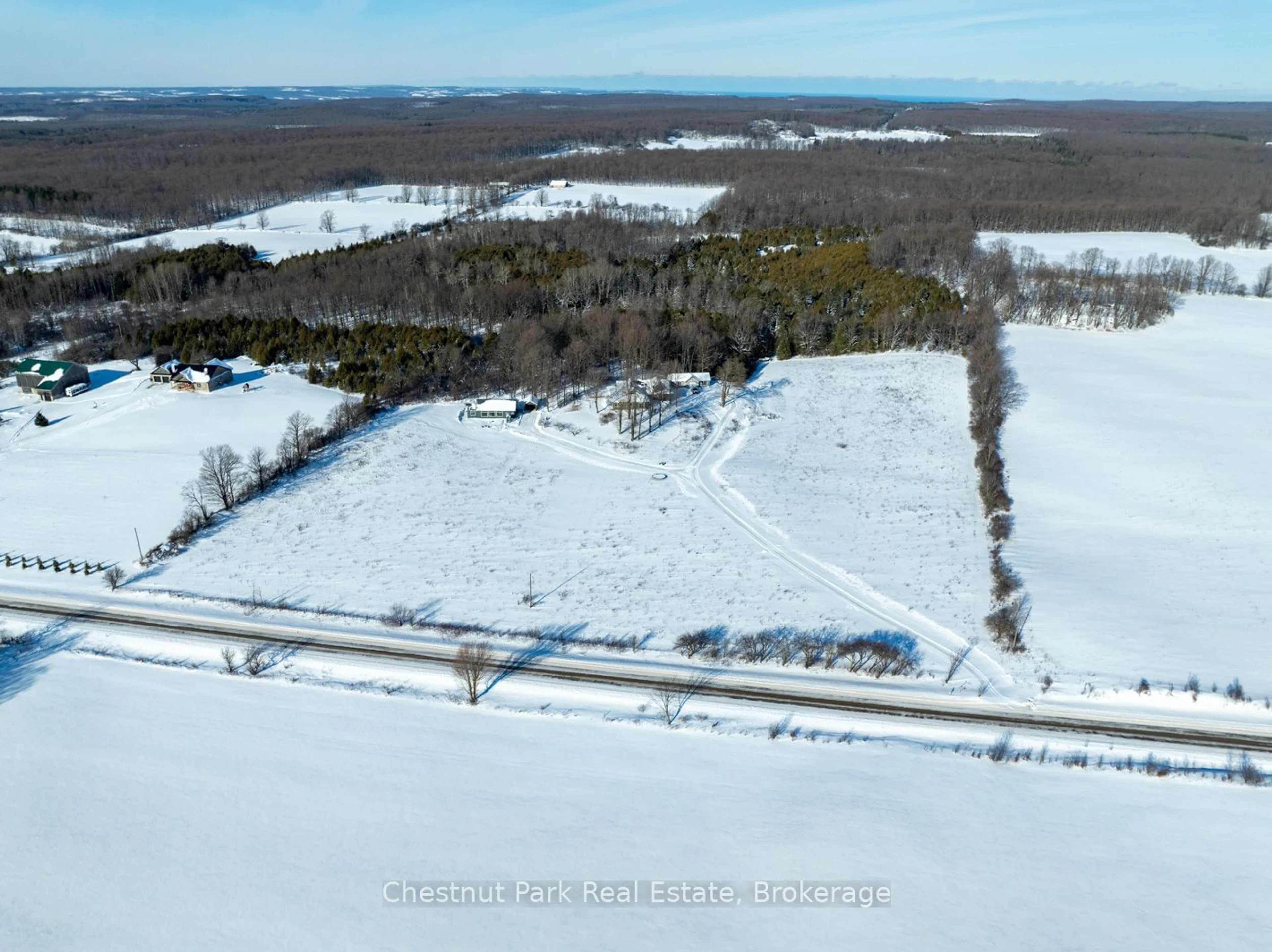 A pic from outside/outdoor area/front of a property/back of a property/a pic from drone, unknown for 468147 12th Concession B, Grey Highlands Ontario N0C 1C0