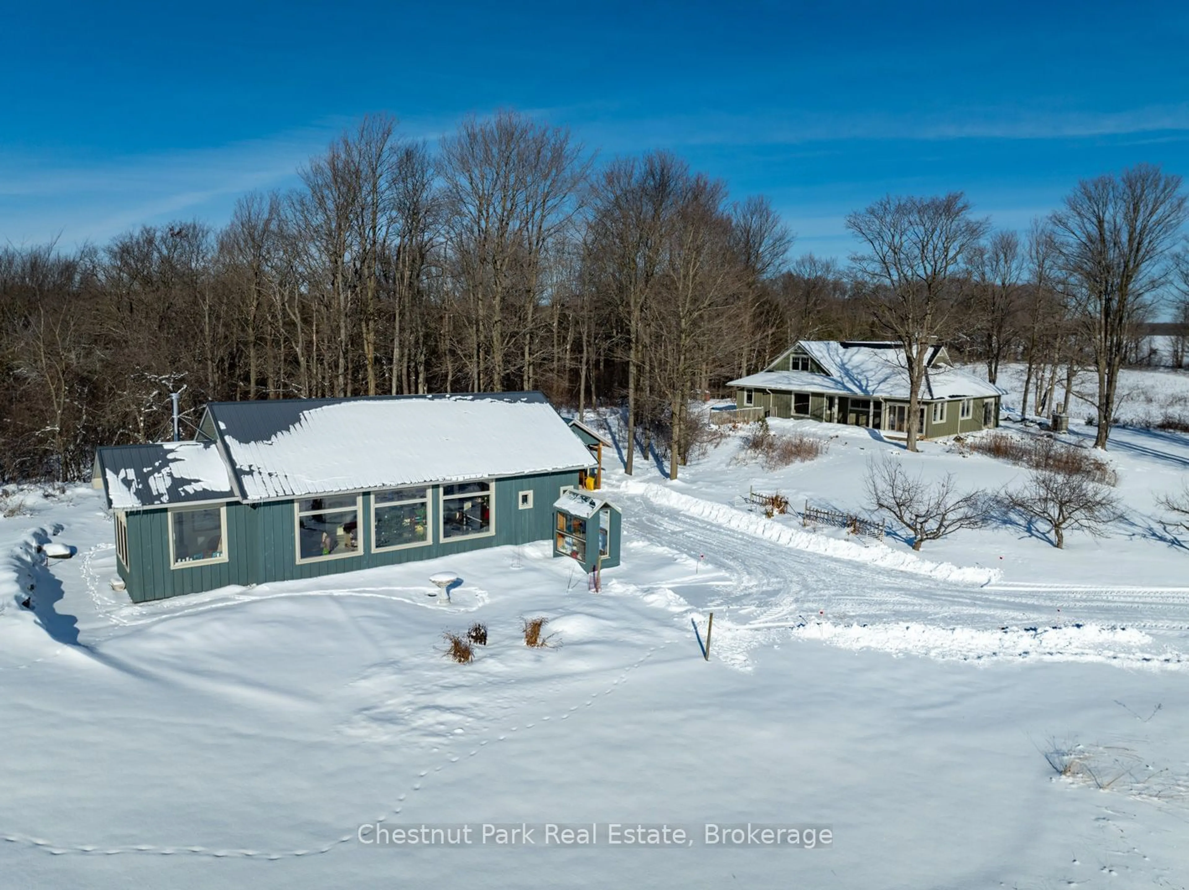 A pic from outside/outdoor area/front of a property/back of a property/a pic from drone, water/lake/river/ocean view for 468147 12th Concession B, Grey Highlands Ontario N0C 1C0