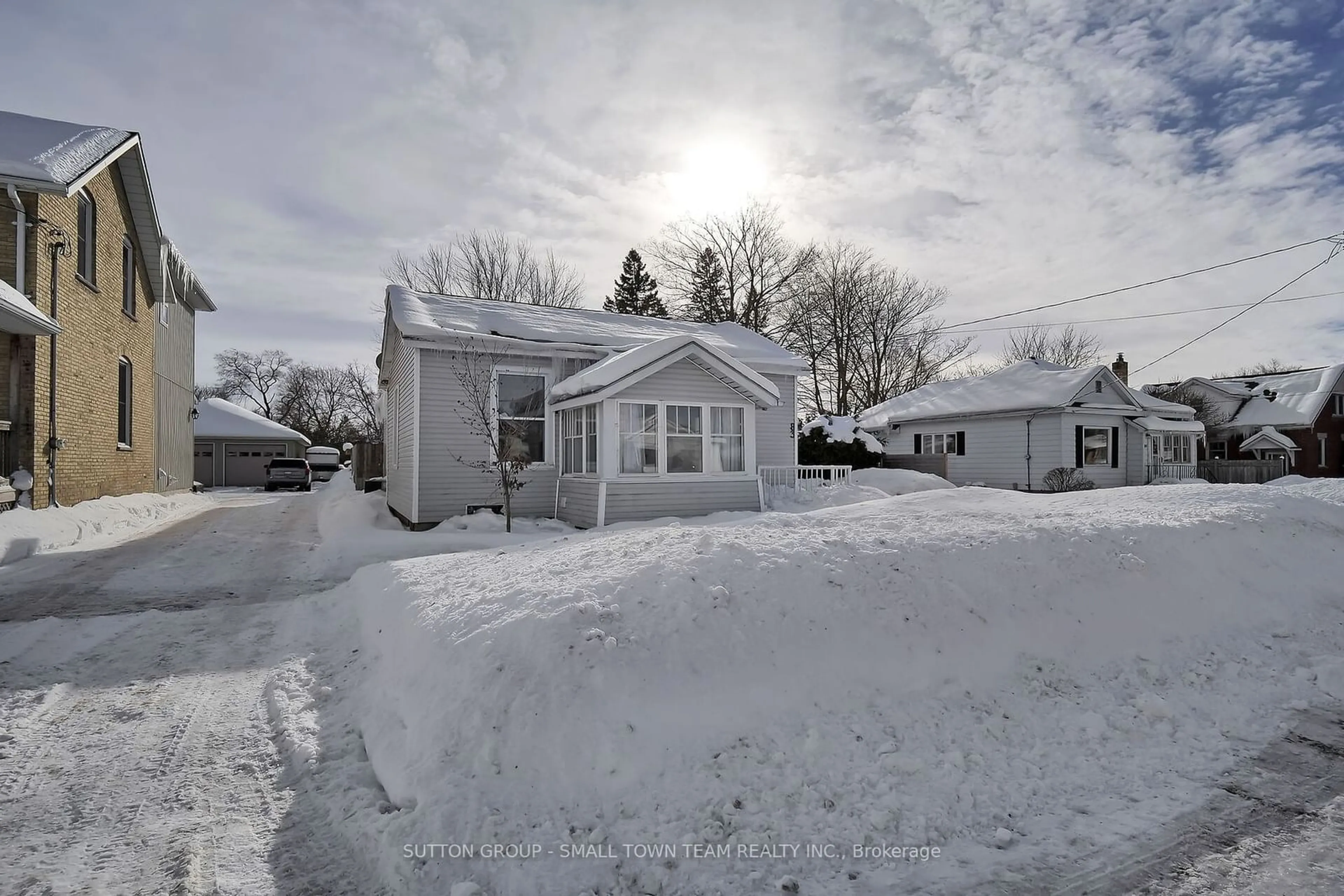 A pic from outside/outdoor area/front of a property/back of a property/a pic from drone, street for 83 John St, South Huron Ontario N0M 1S1