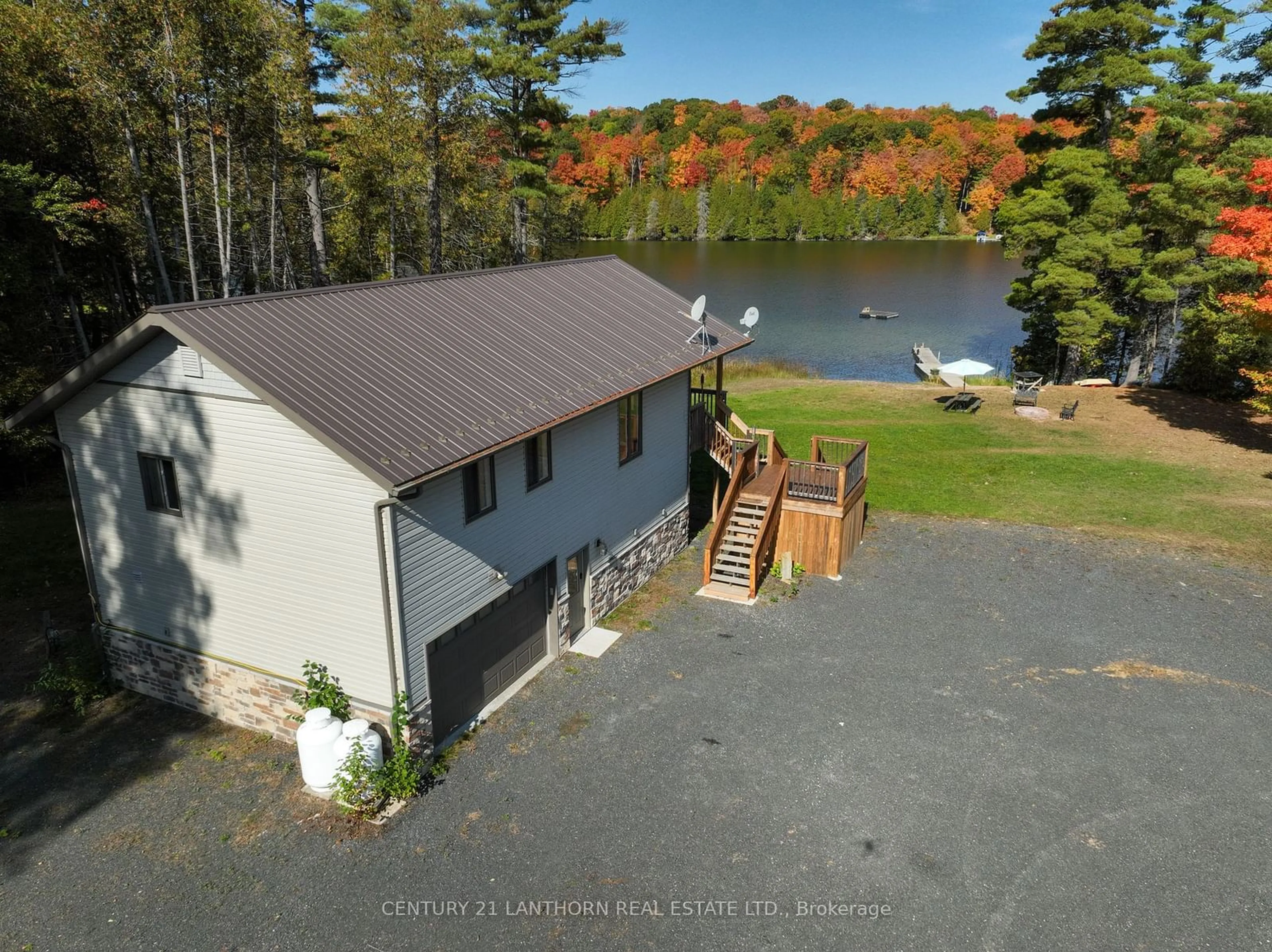 A pic from outside/outdoor area/front of a property/back of a property/a pic from drone, water/lake/river/ocean view for 1014b Lyons Gate Lane, North Frontenac Ontario K0H 1K0