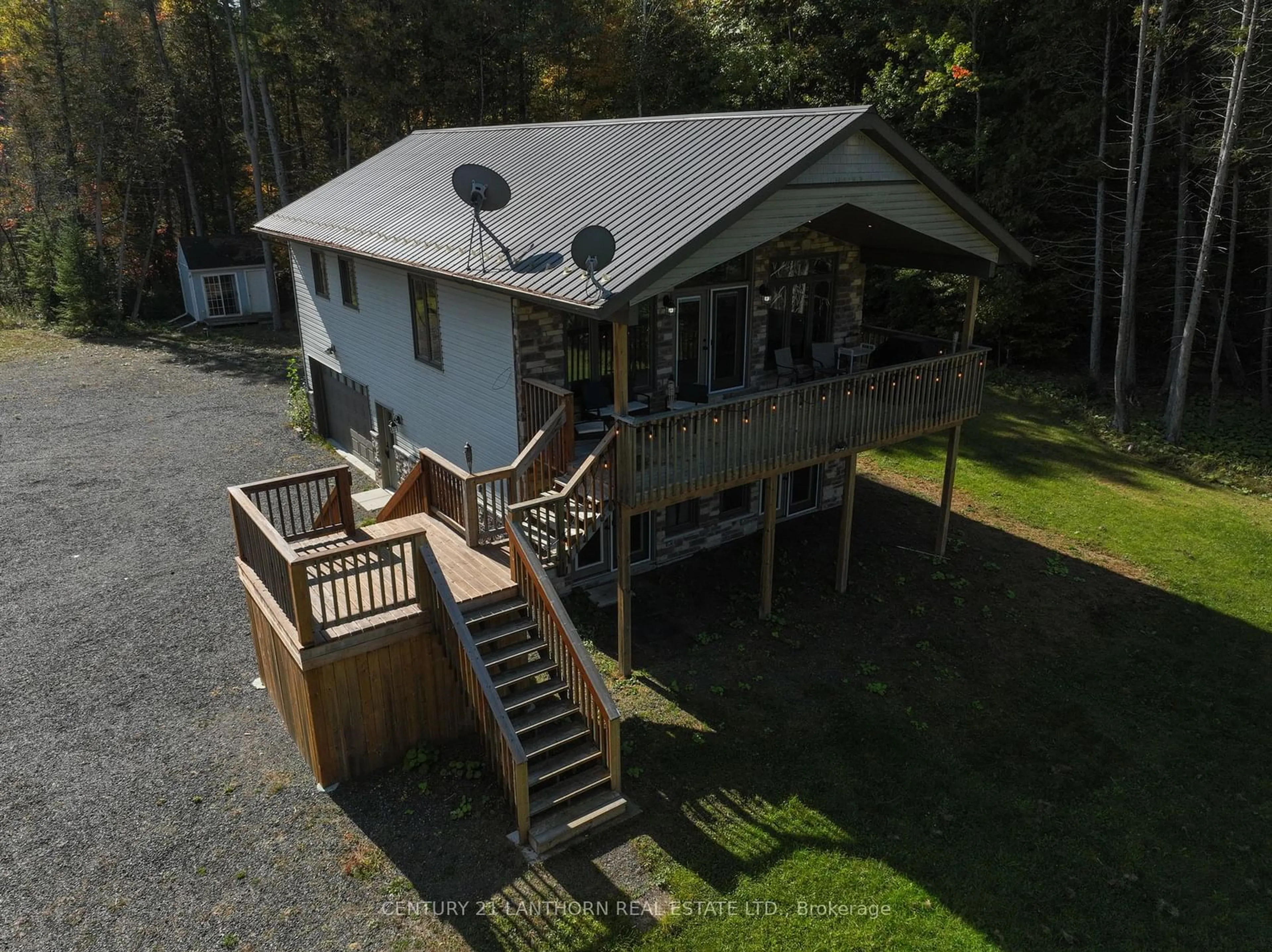 A pic from outside/outdoor area/front of a property/back of a property/a pic from drone, water/lake/river/ocean view for 1014b Lyons Gate Lane, North Frontenac Ontario K0H 1K0