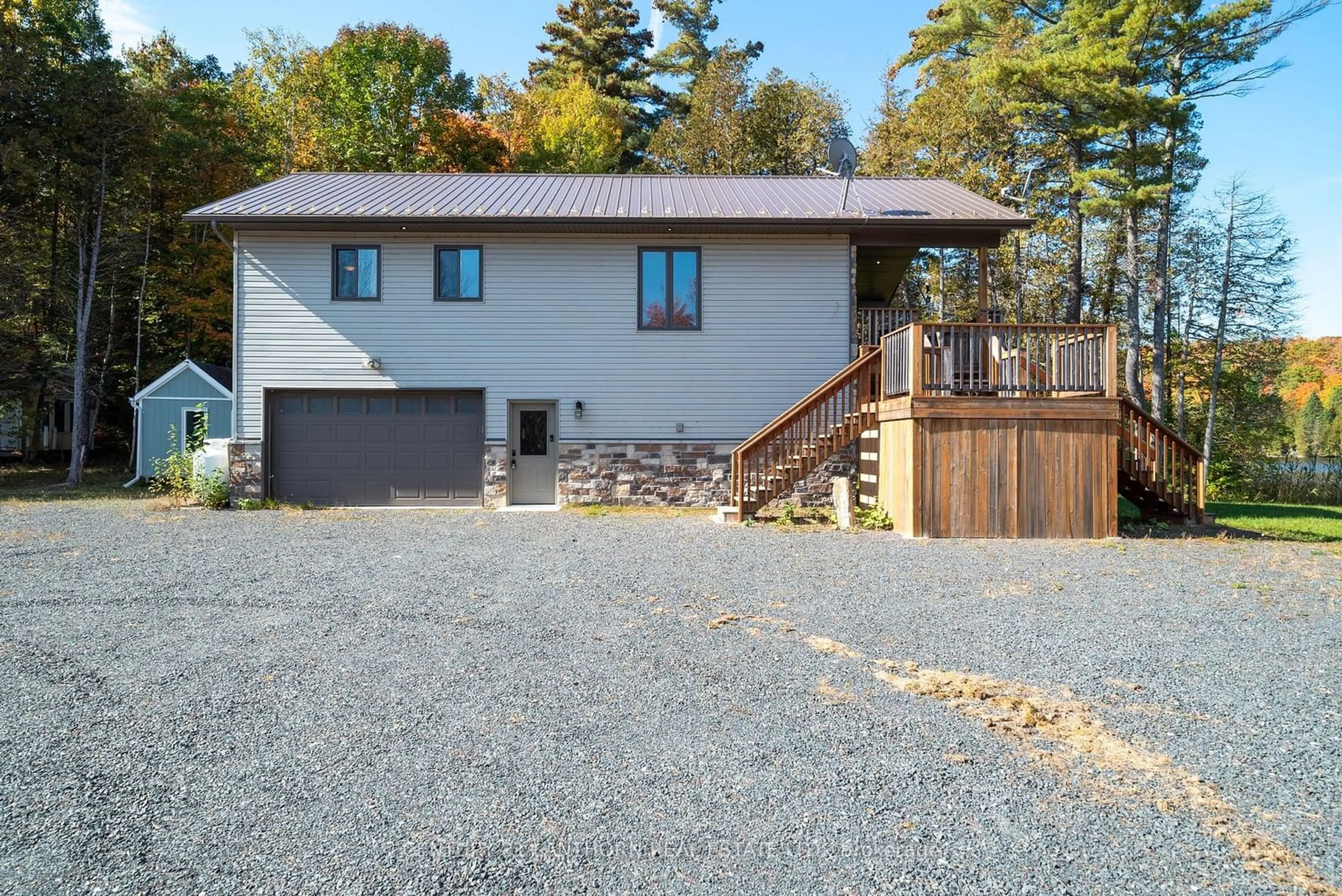 Home with vinyl exterior material, street for 1014b Lyons Gate Lane, North Frontenac Ontario K0H 1K0