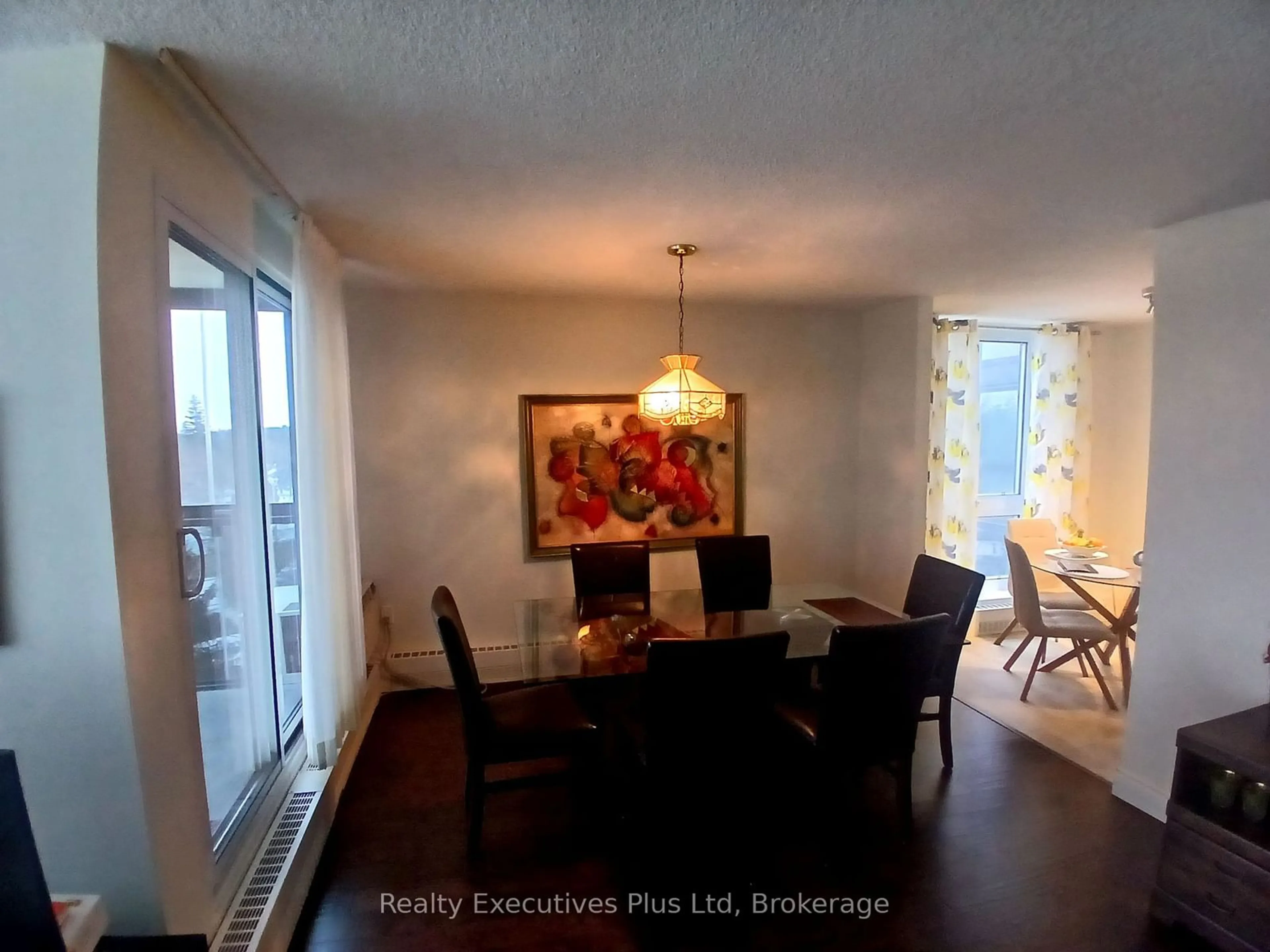 Dining room, wood/laminate floor for 19 Woodlawn Rd #704, Guelph Ontario N1H 7B1