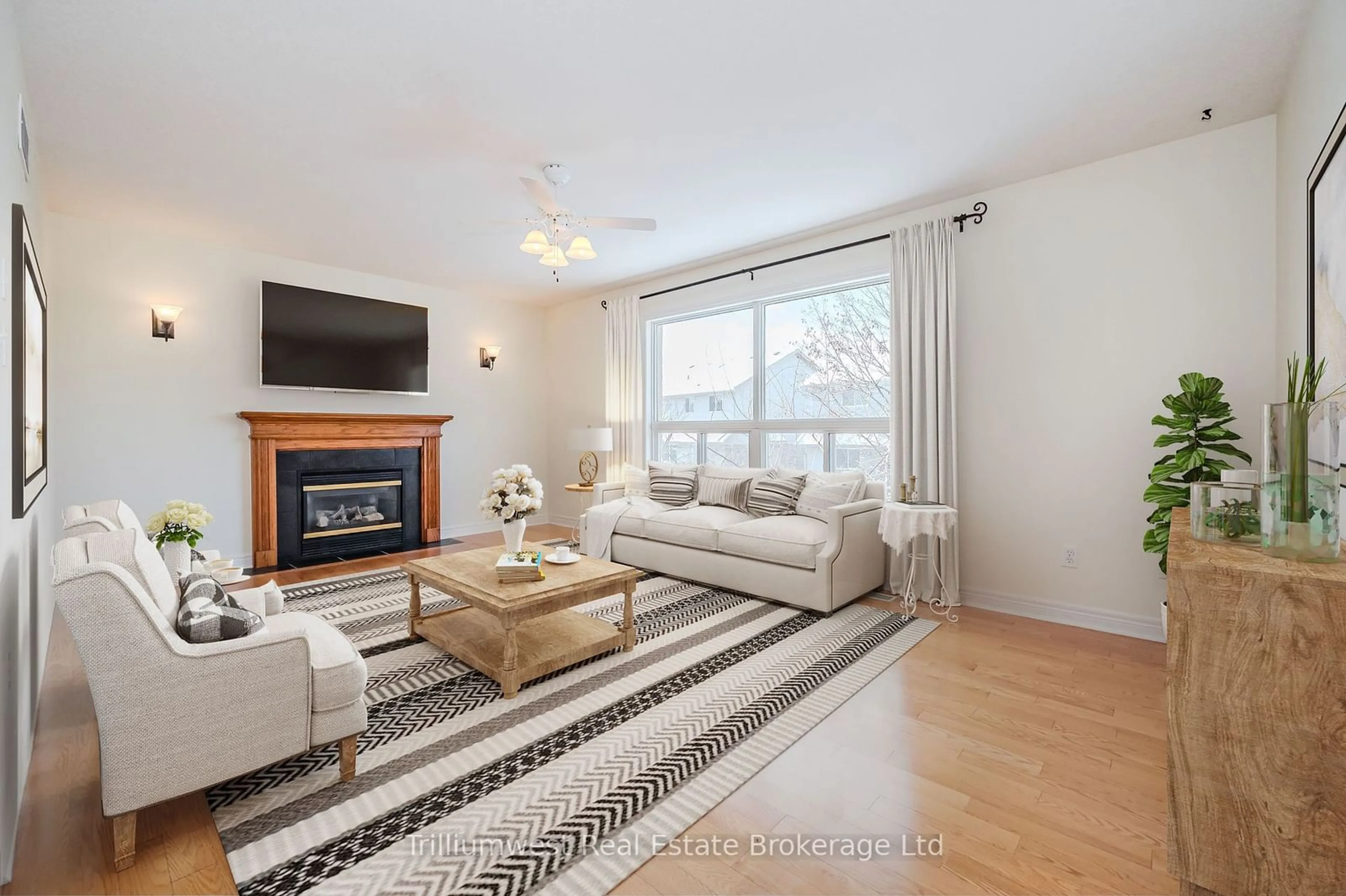 Living room with furniture, wood/laminate floor for 67 MUNROE Cres, Guelph Ontario N1G 5E4