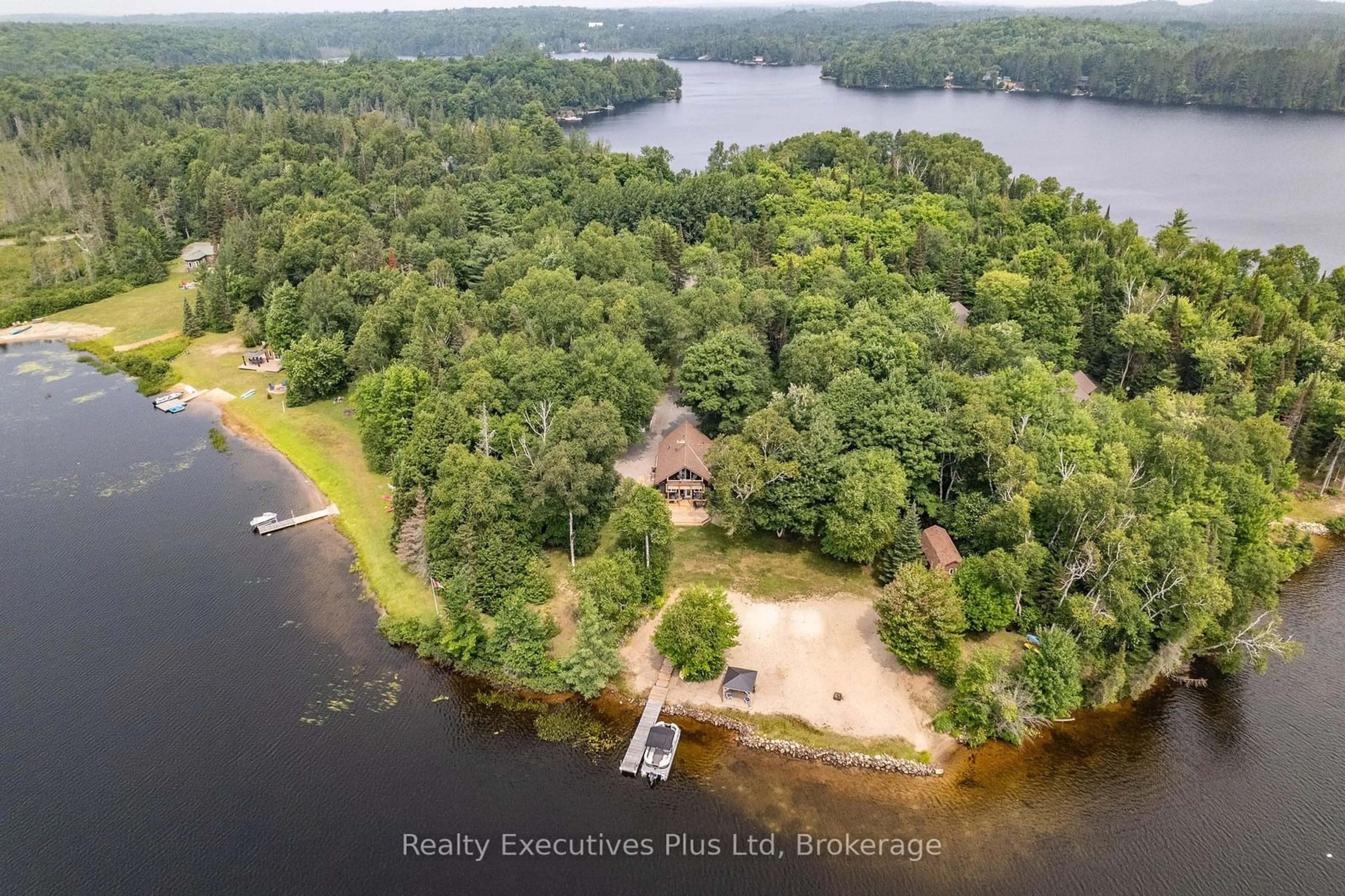 A pic from outside/outdoor area/front of a property/back of a property/a pic from drone, water/lake/river/ocean view for 739 Deer Lake Rd, Parry Sound Ontario P0A 1X0