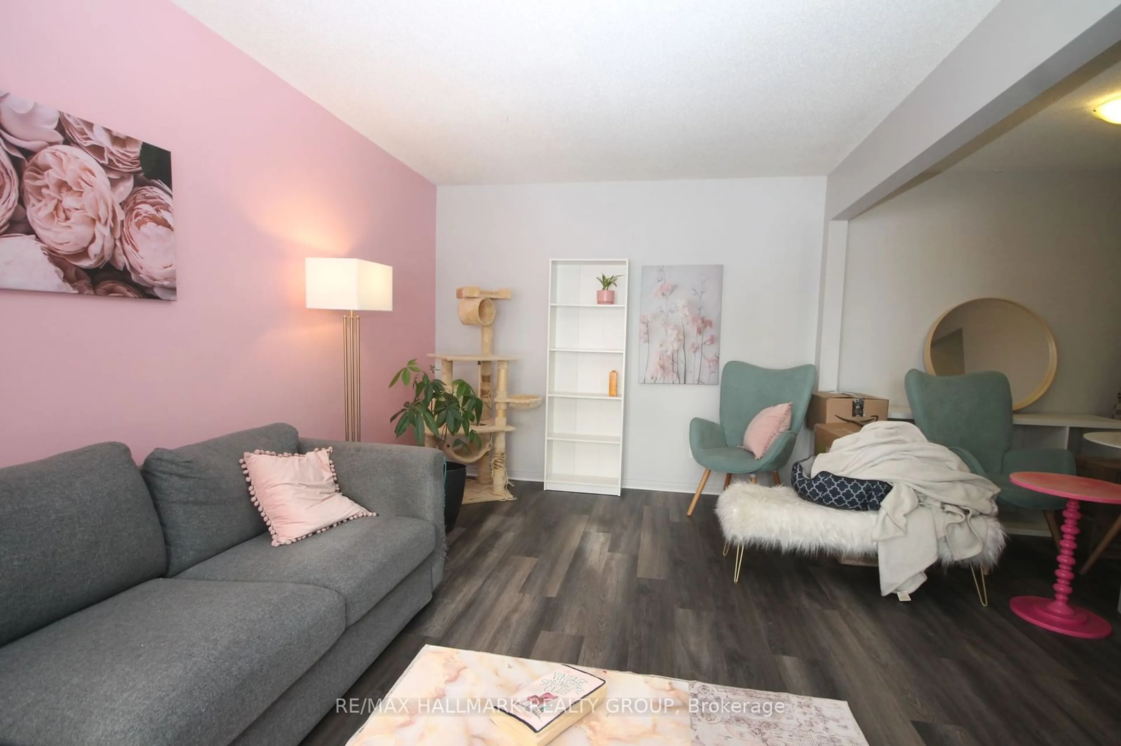 Living room with furniture, wood/laminate floor for 107 SALTER Cres, Kanata Ontario K2K 1Y7