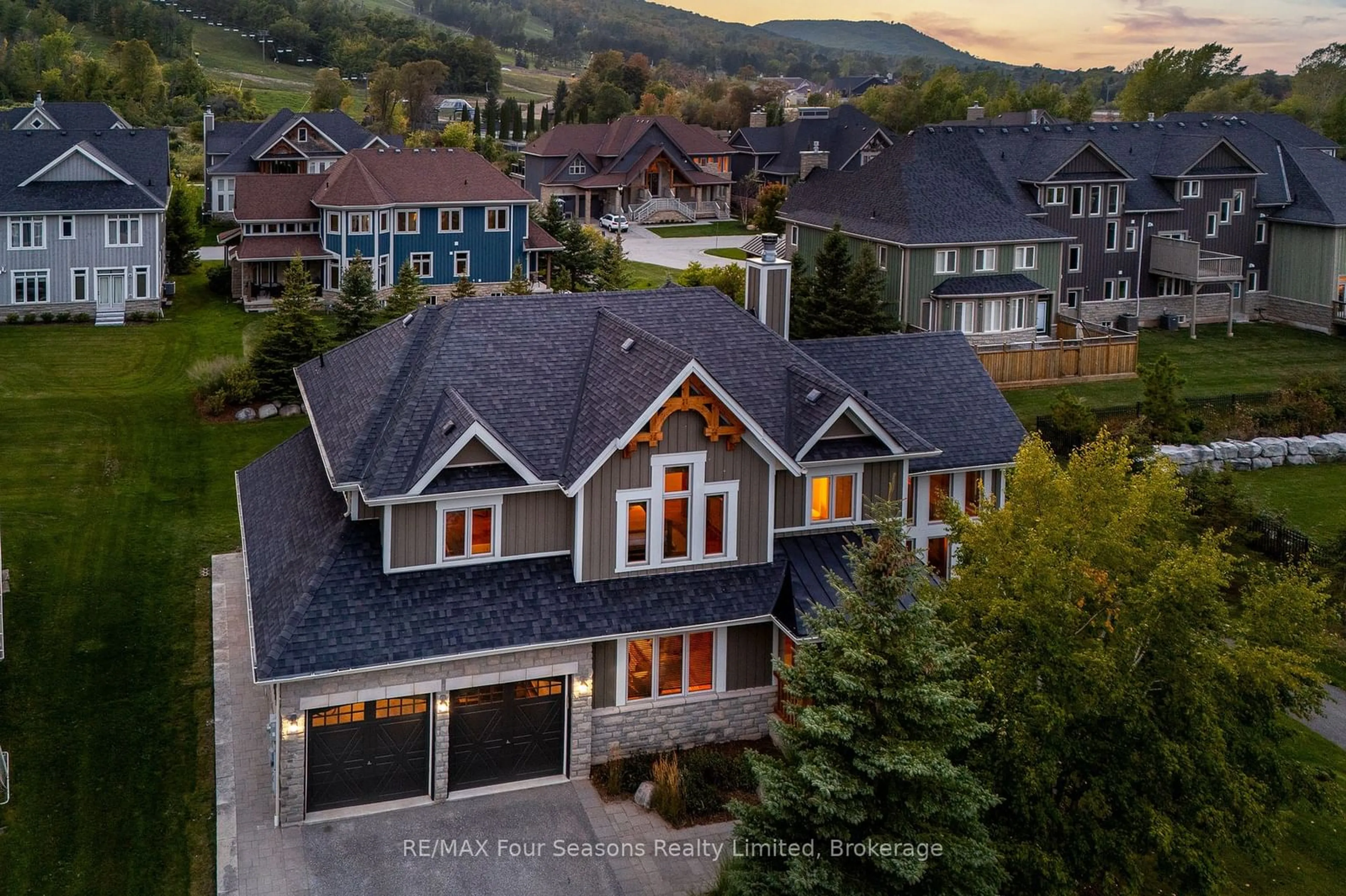 A pic from outside/outdoor area/front of a property/back of a property/a pic from drone, mountain view for 106 Manitou Crt, Blue Mountains Ontario L9Y 0B6