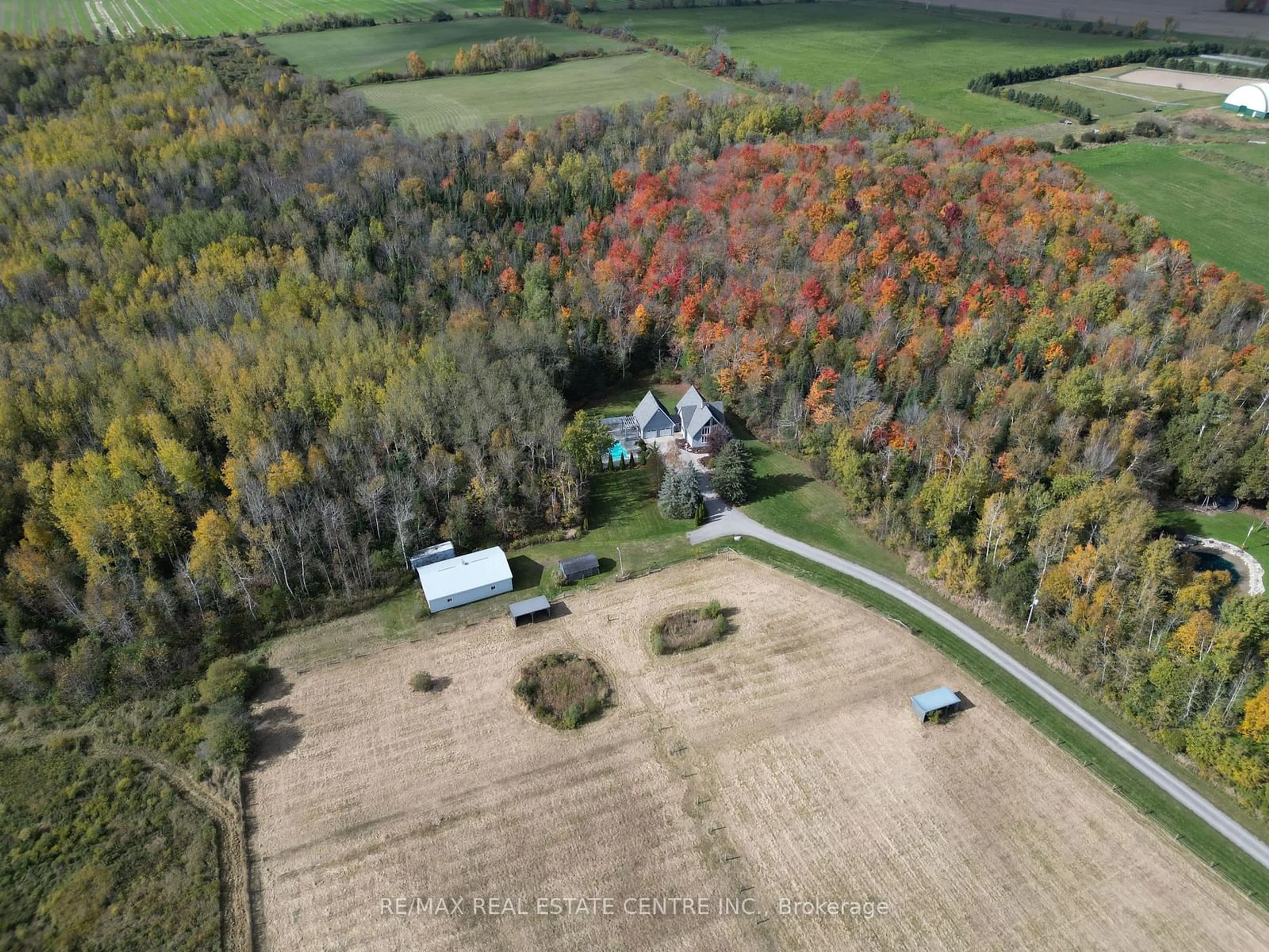 A pic from outside/outdoor area/front of a property/back of a property/a pic from drone, forest/trees view for 373376 6th Line, Amaranth Ontario L9W 0M5