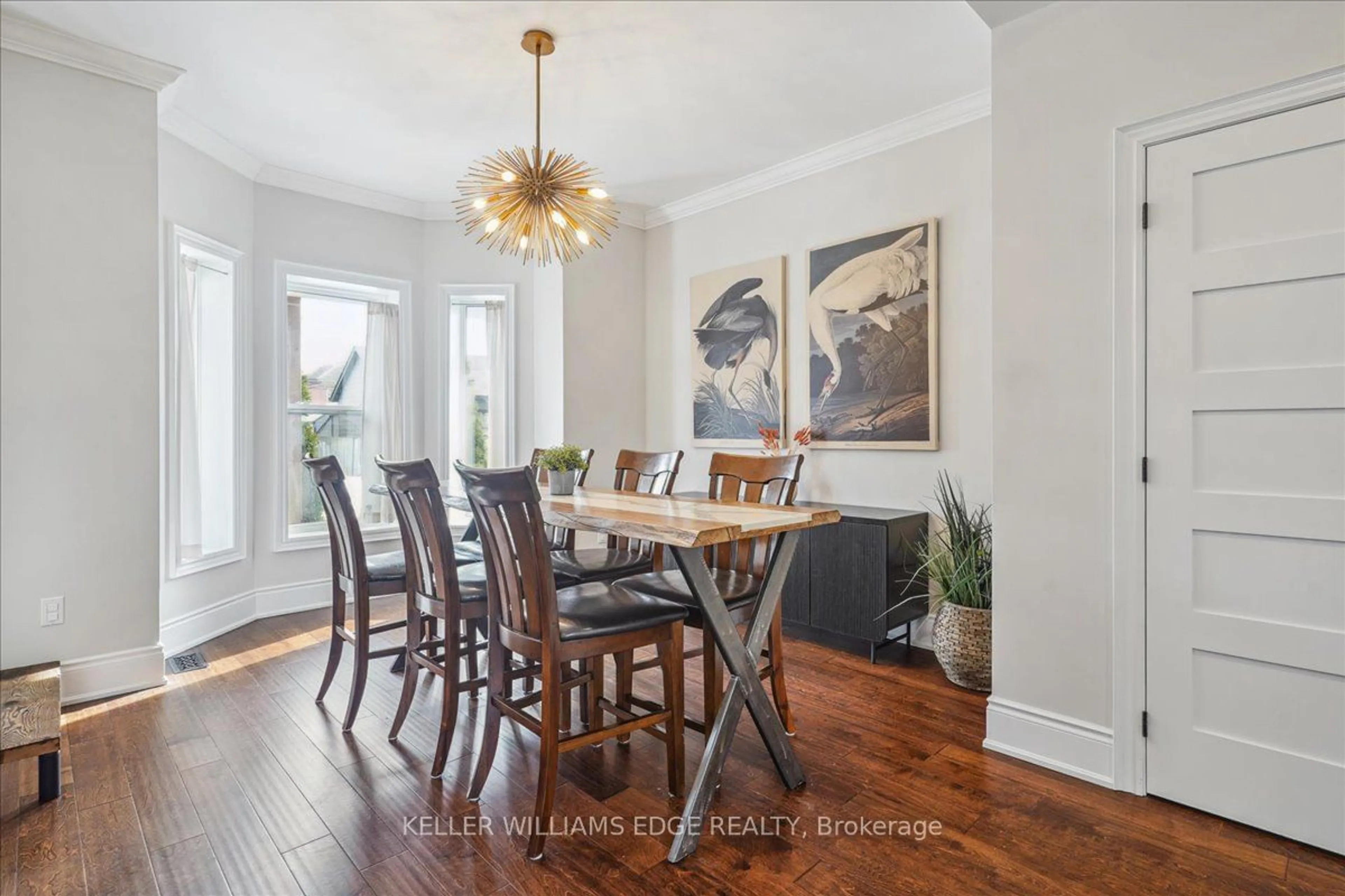 Dining room, wood/laminate floor for 49 Oak Ave, Hamilton Ontario L8L 5M7