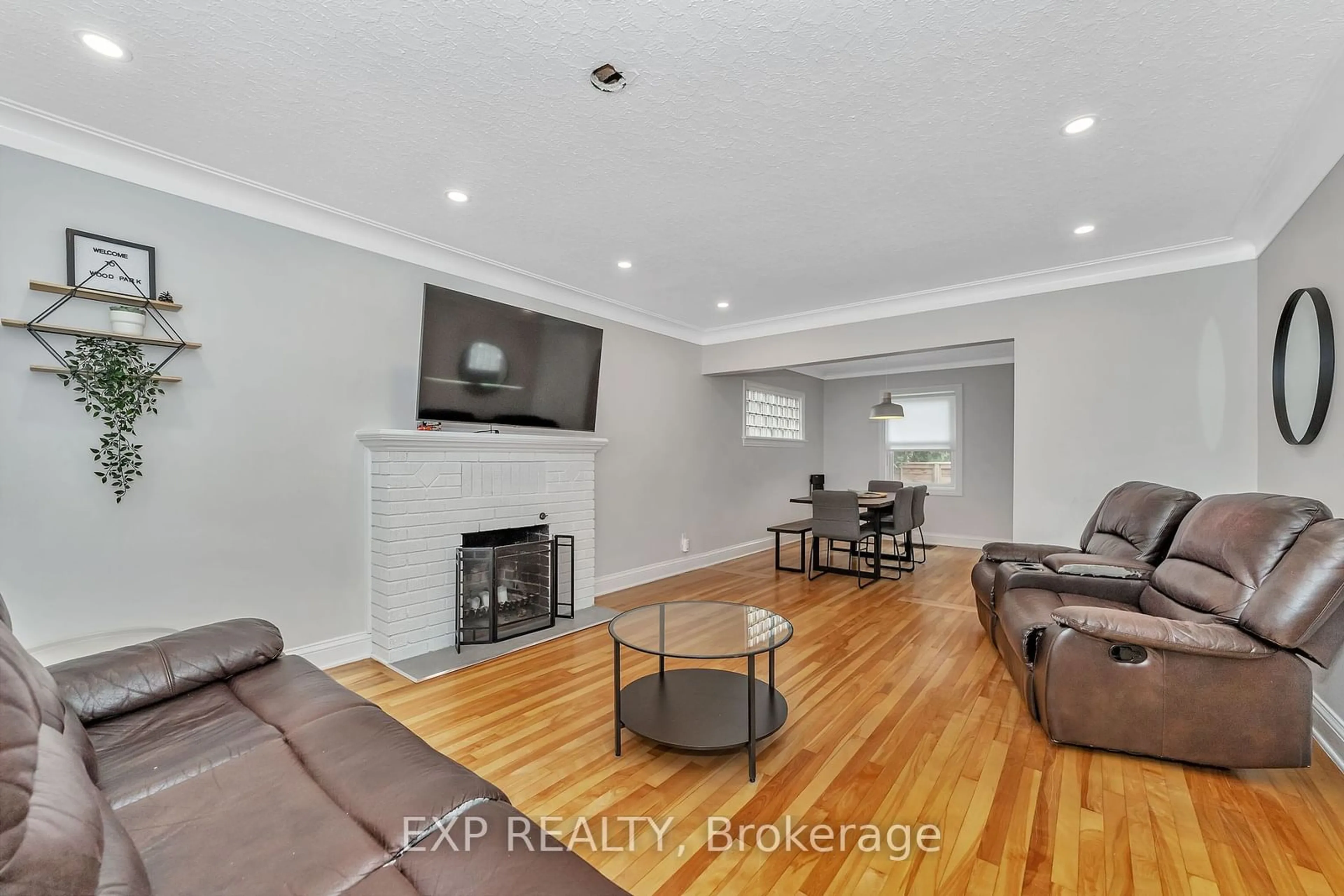 Living room with furniture, wood/laminate floor for 512 Hartleigh Ave, Woodroffe Ontario K2B 5J6