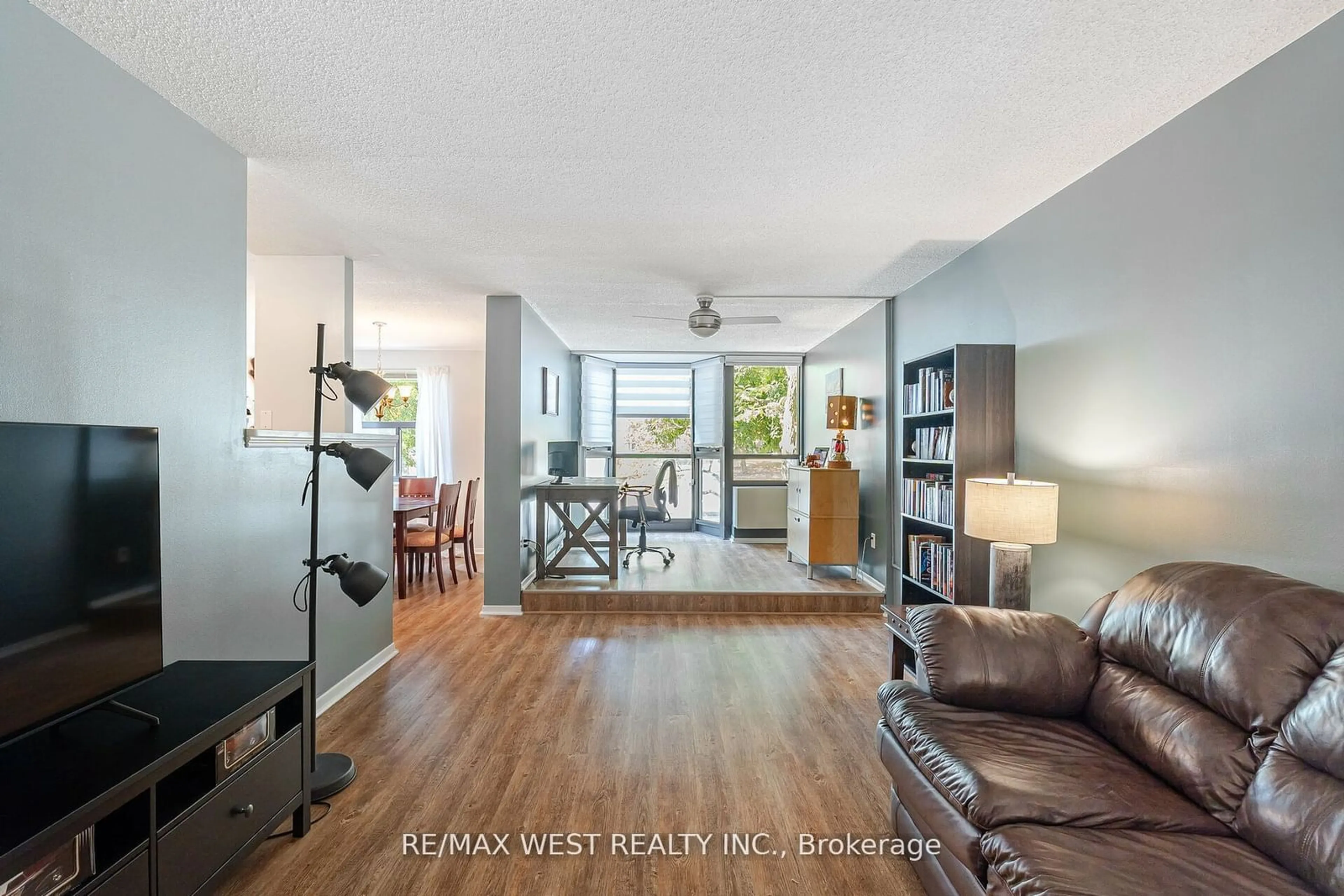 Living room with furniture, wood/laminate floor for 10 Ajax St #209, Guelph Ontario N1H 7N6