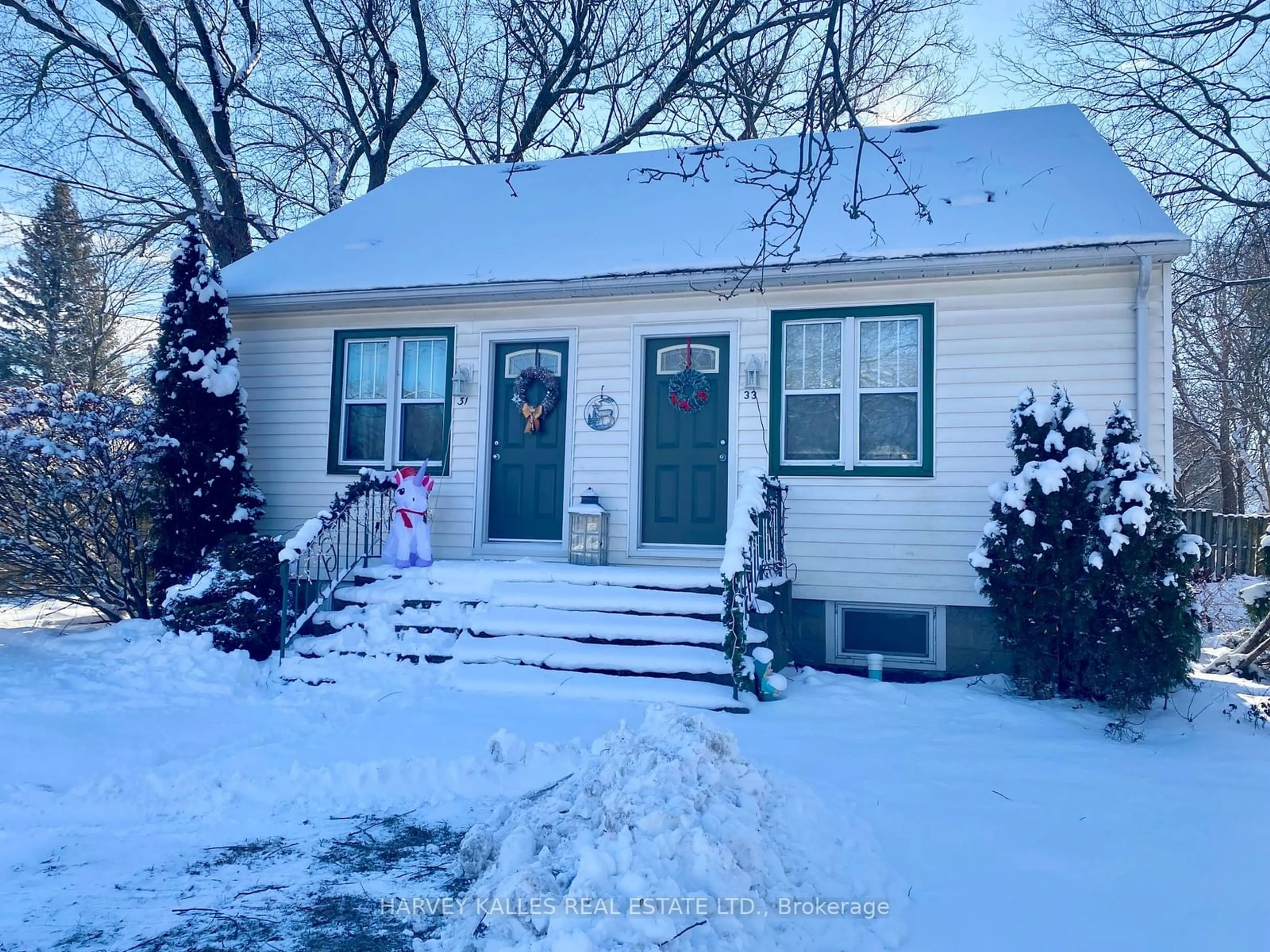 Home with vinyl exterior material, street for 31- 33 Washburn St, Prince Edward County Ontario K0K 2T0