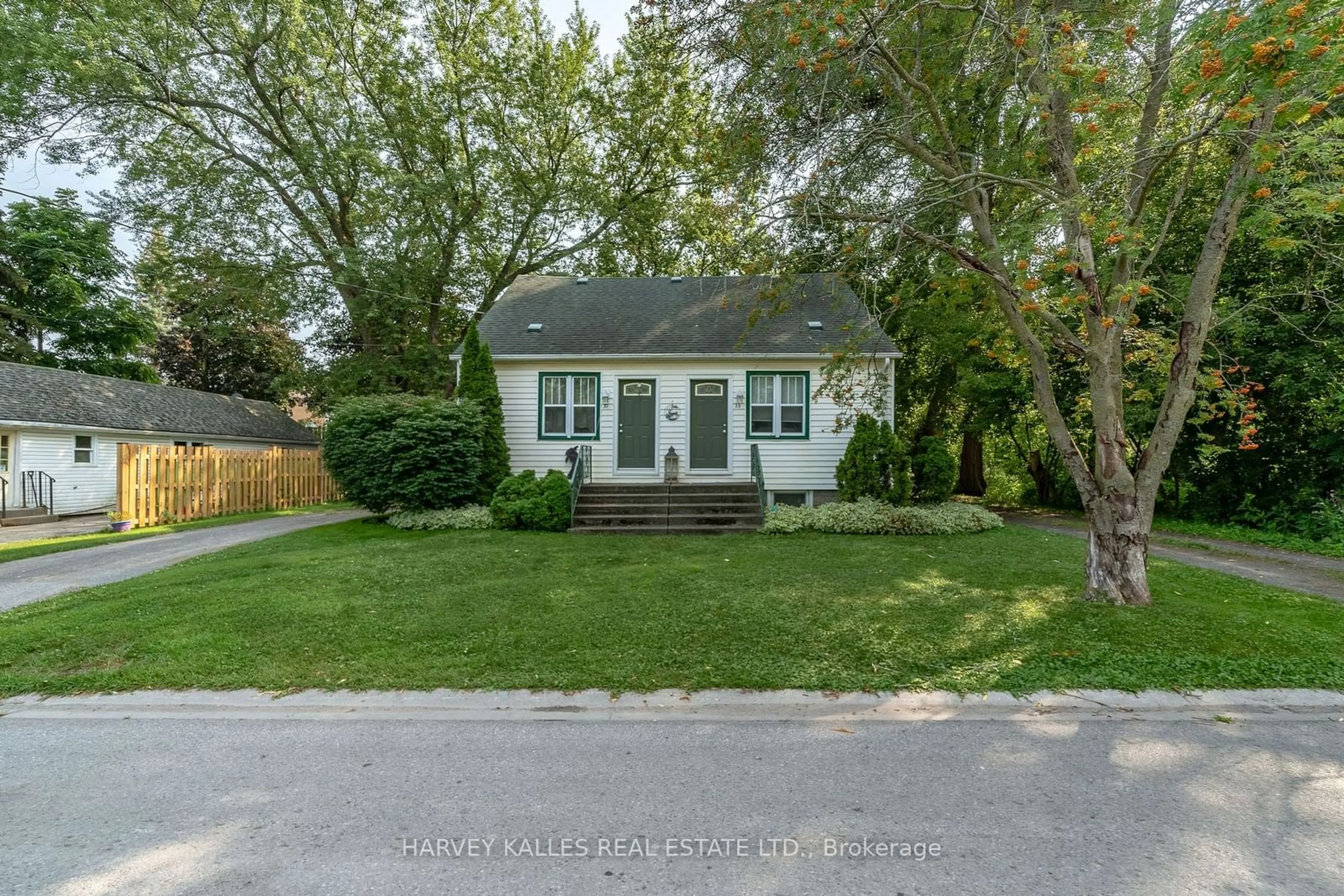 Home with vinyl exterior material, street for 31- 33 Washburn St, Prince Edward County Ontario K0K 2T0