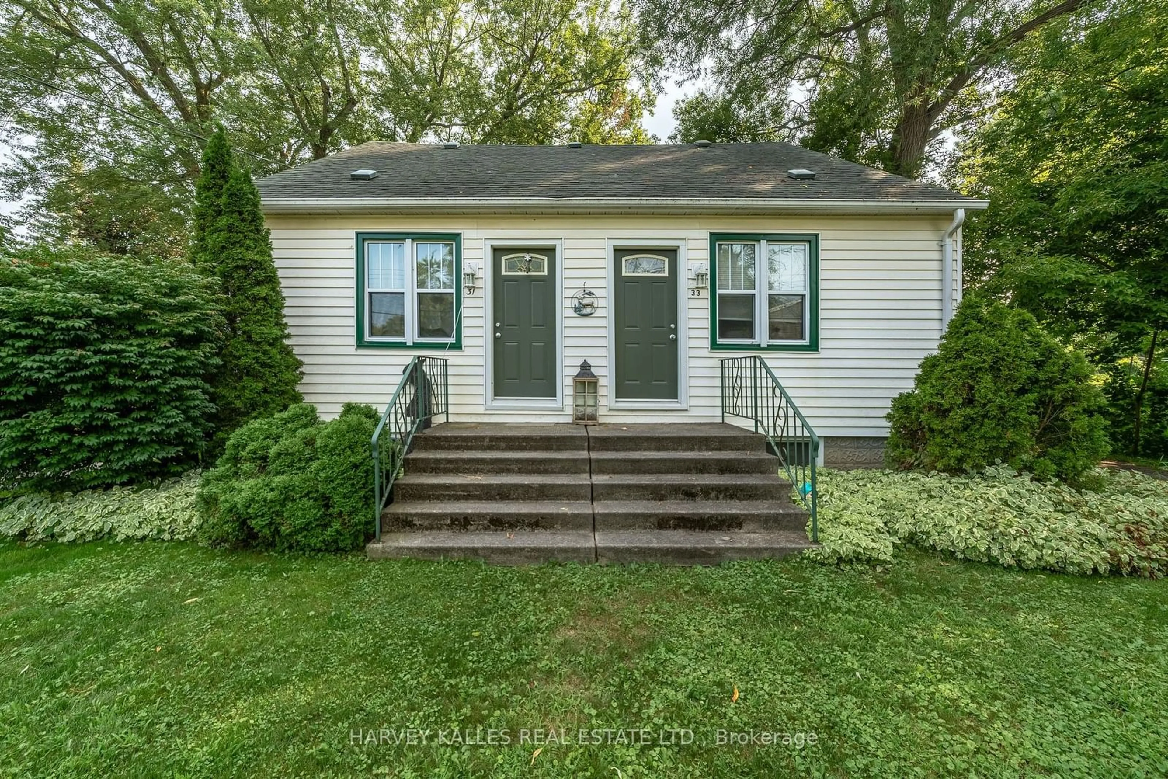 Home with vinyl exterior material, street for 31- 33 Washburn St, Prince Edward County Ontario K0K 2T0