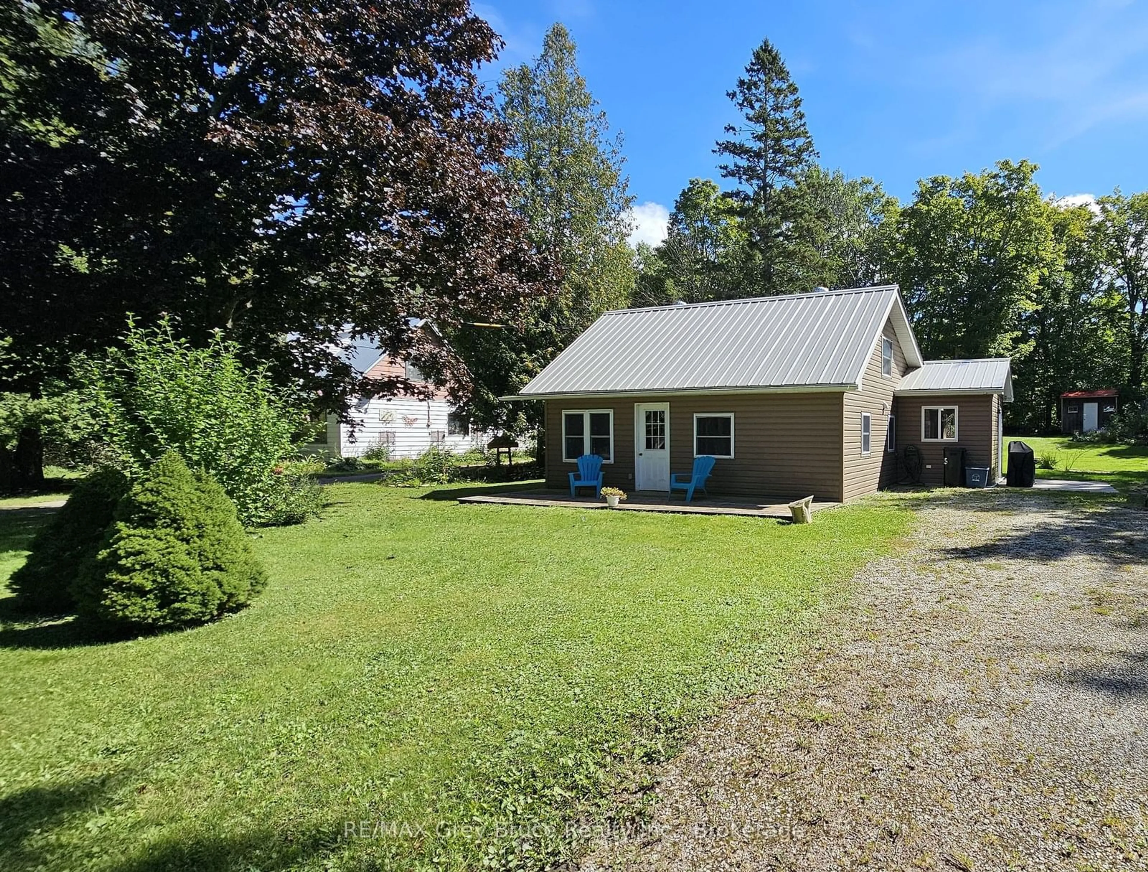 A pic from outside/outdoor area/front of a property/back of a property/a pic from drone, street for 549 Stokes Bay Rd, Northern Bruce Peninsula Ontario N0H 1W0