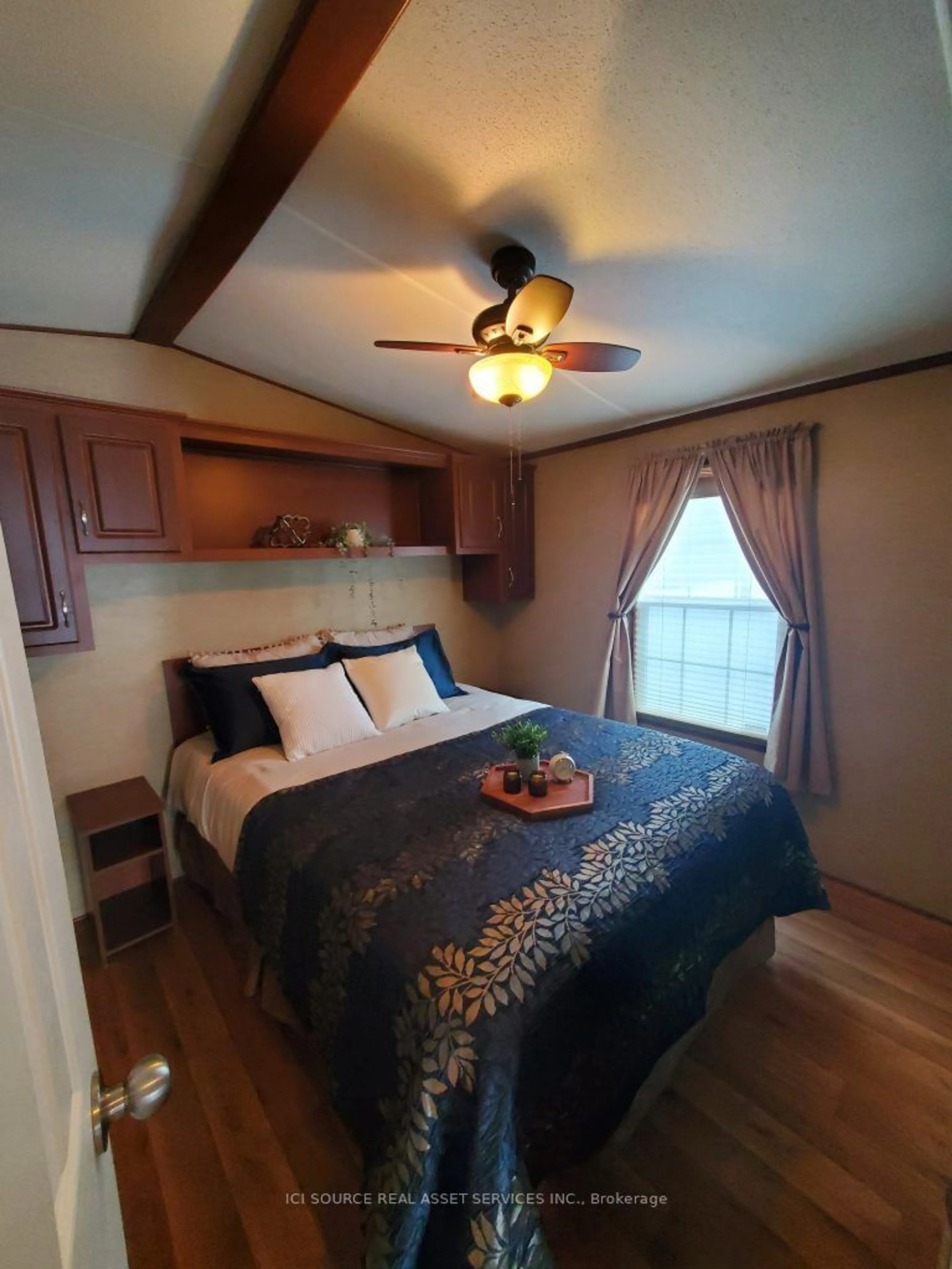 Bedroom with bed, wood/laminate floor for 171 Woodland Estates Rd #BWD020, Trent Hills Ontario K0L 1L0