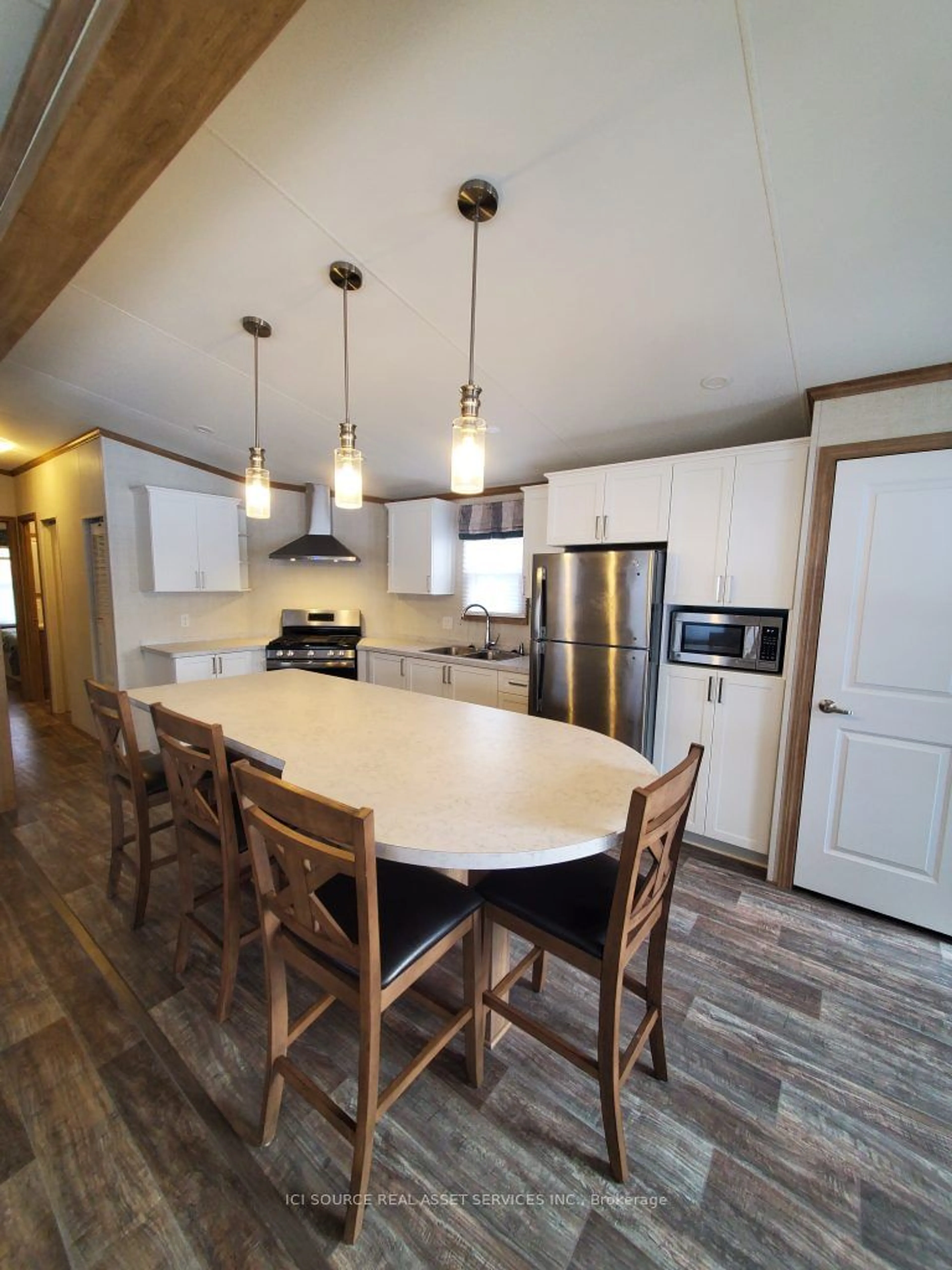 Open concept kitchen, wood/laminate floor for 171 Woodland Estates Rd #BWD009, Trent Hills Ontario K0L 1L0