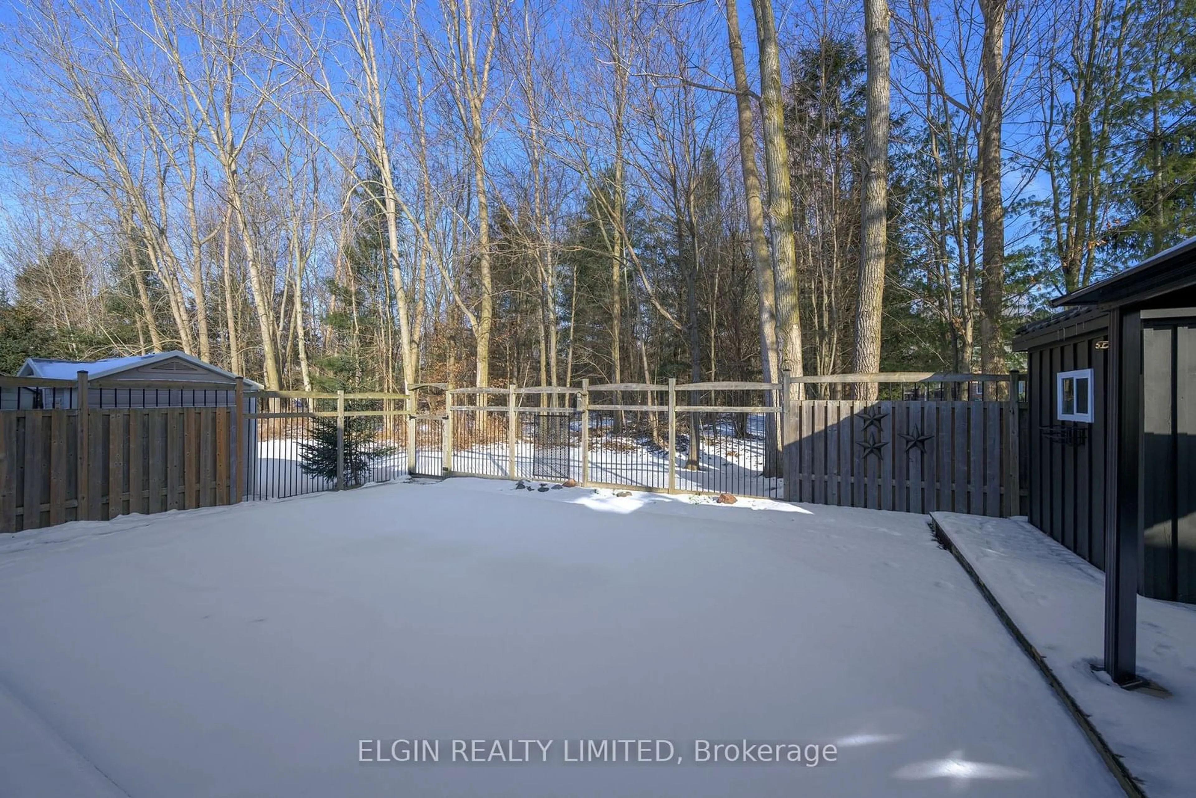 A pic from outside/outdoor area/front of a property/back of a property/a pic from drone, forest/trees view for 15 Hummingbird Lane, St. Thomas Ontario N5R 6L8