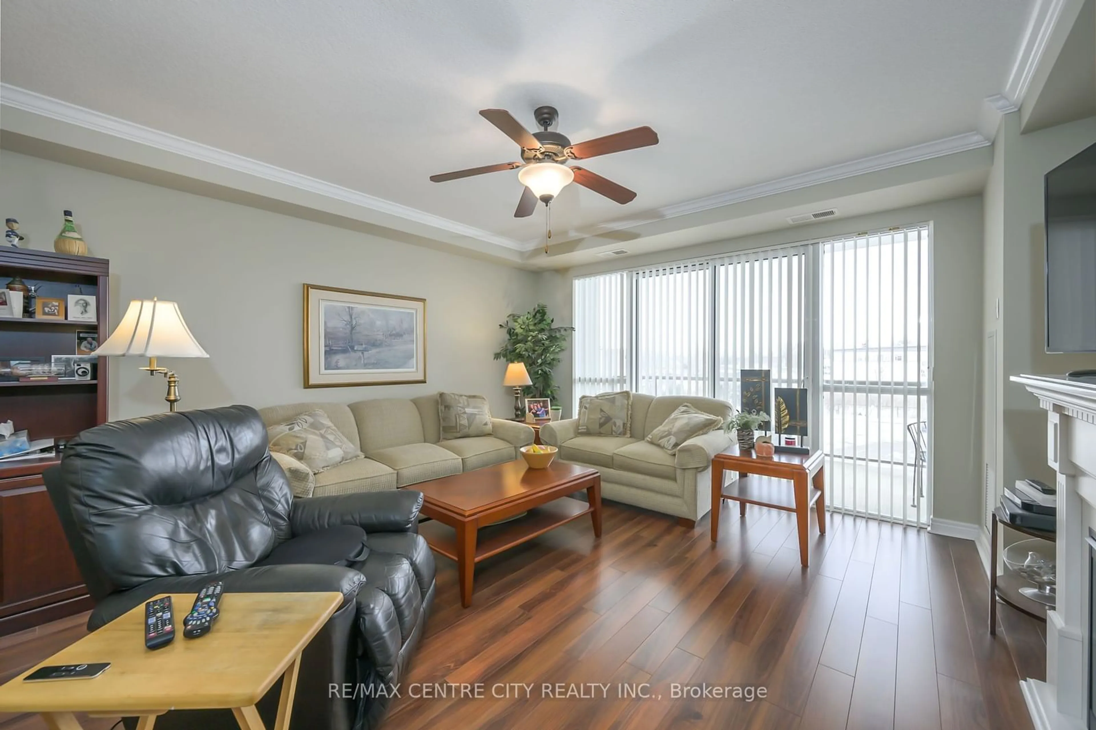 Living room with furniture, wood/laminate floor for 1030 CORONATION Dr #306, London Ontario N6G 0G5