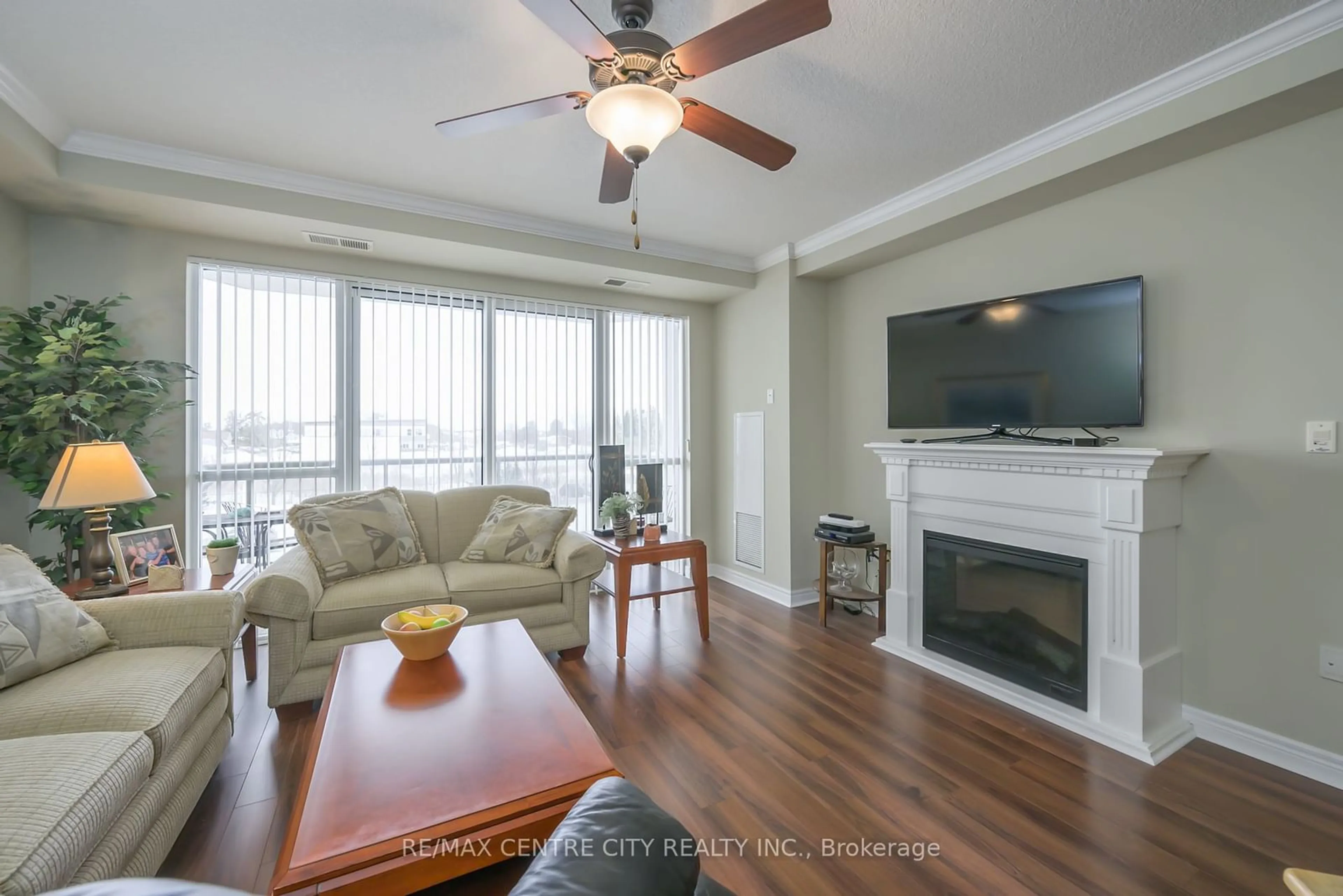 Living room with furniture, wood/laminate floor for 1030 CORONATION Dr #306, London Ontario N6G 0G5