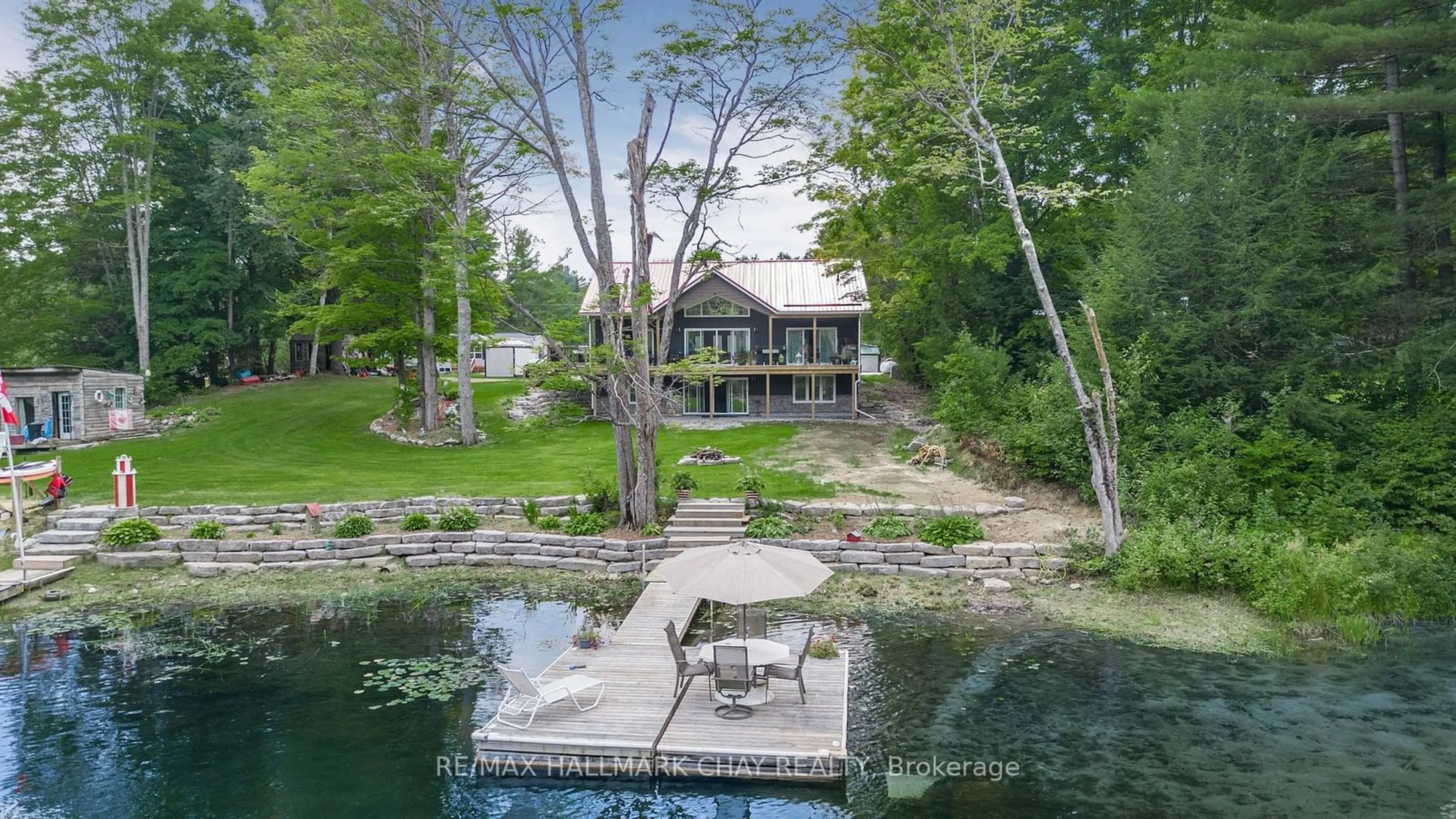 A pic from outside/outdoor area/front of a property/back of a property/a pic from drone, water/lake/river/ocean view for 7544 Highway 35, Kawartha Lakes Ontario K0M 2L0