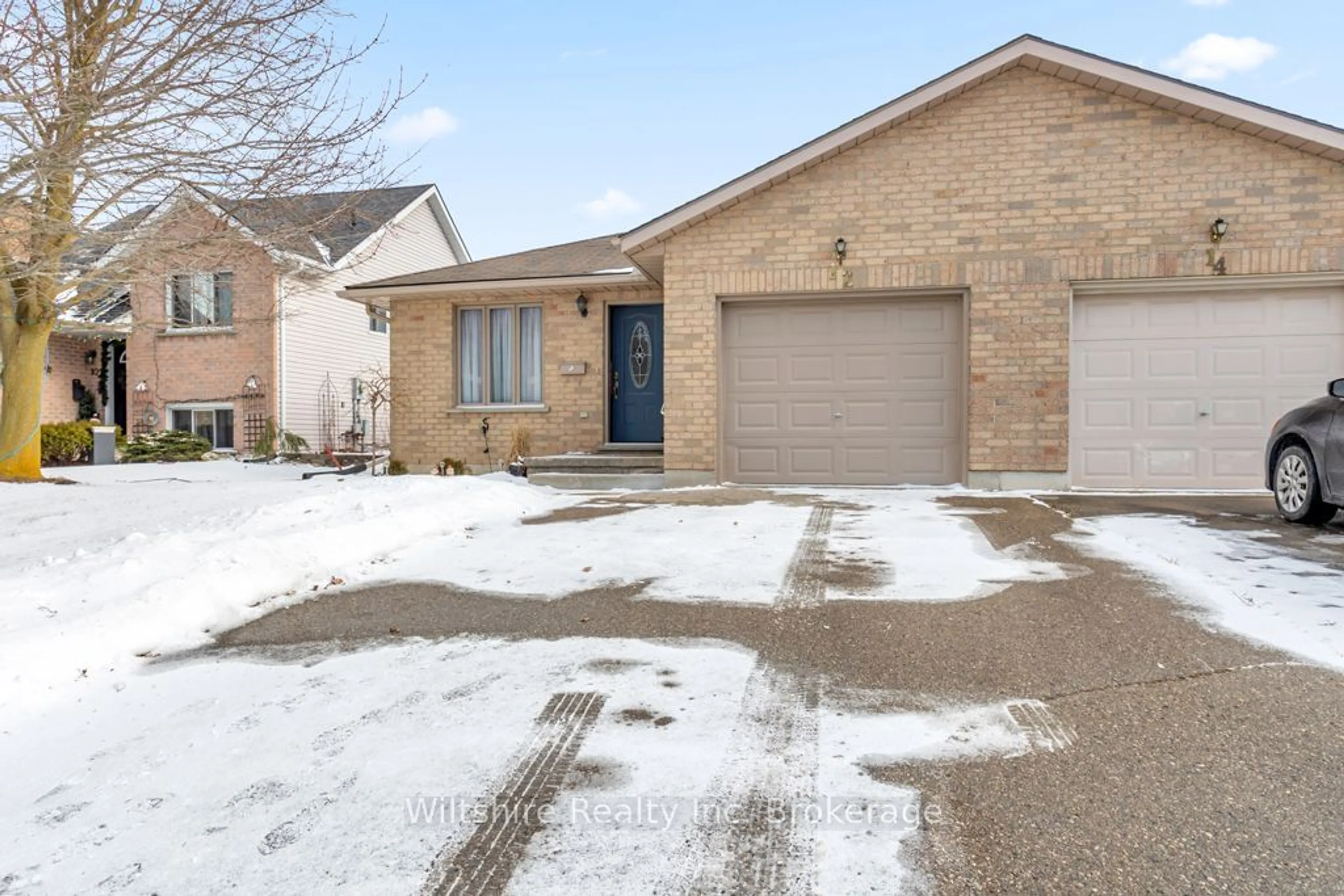 Home with brick exterior material, street for 12 Magnolia Dr, Tillsonburg Ontario N4G 5N9