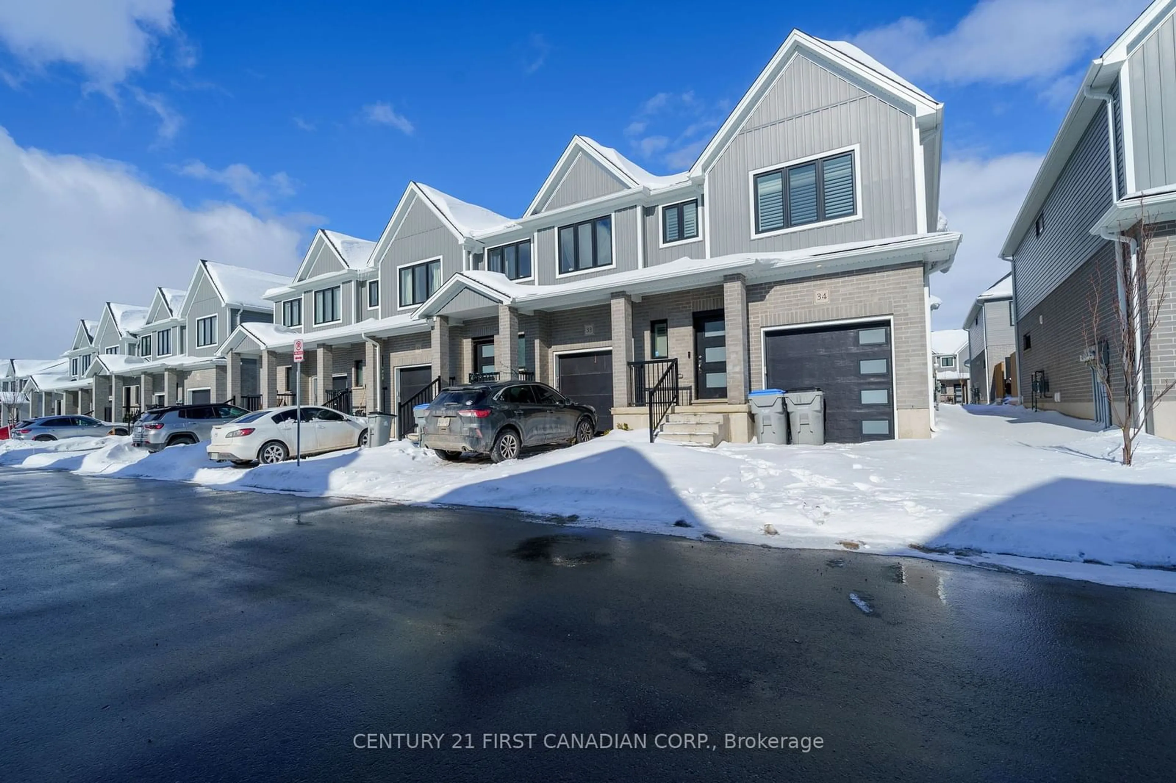 A pic from outside/outdoor area/front of a property/back of a property/a pic from drone, street for 1 MILLER Dr #34, Lucan Biddulph Ontario N0M 2J0