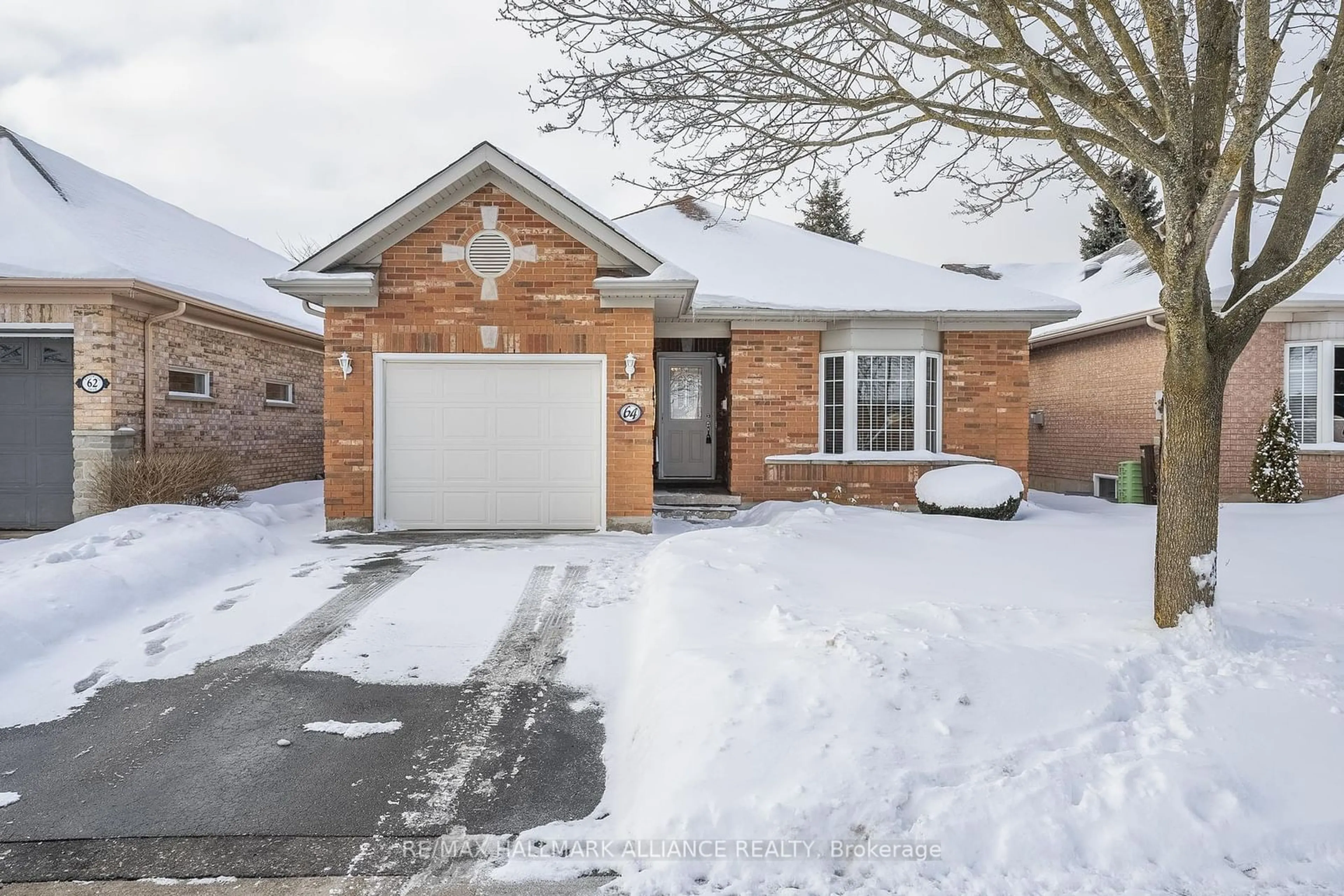 Home with brick exterior material, street for 64 BASSWOOD Dr, Guelph Ontario N1G 4X7