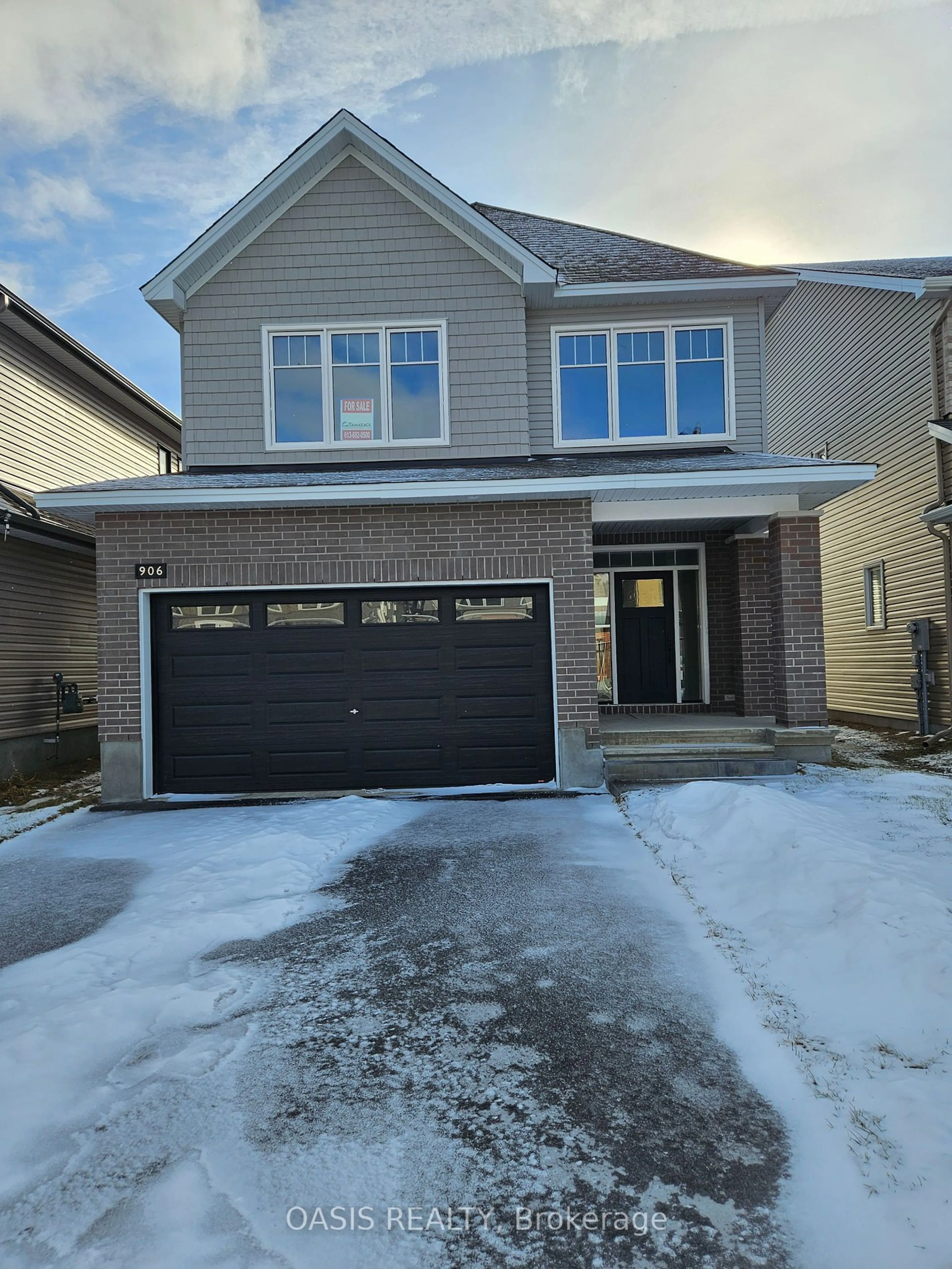 Home with brick exterior material, street for 906 ECHINACEA Row, Barrhaven Ontario K2J 7A4