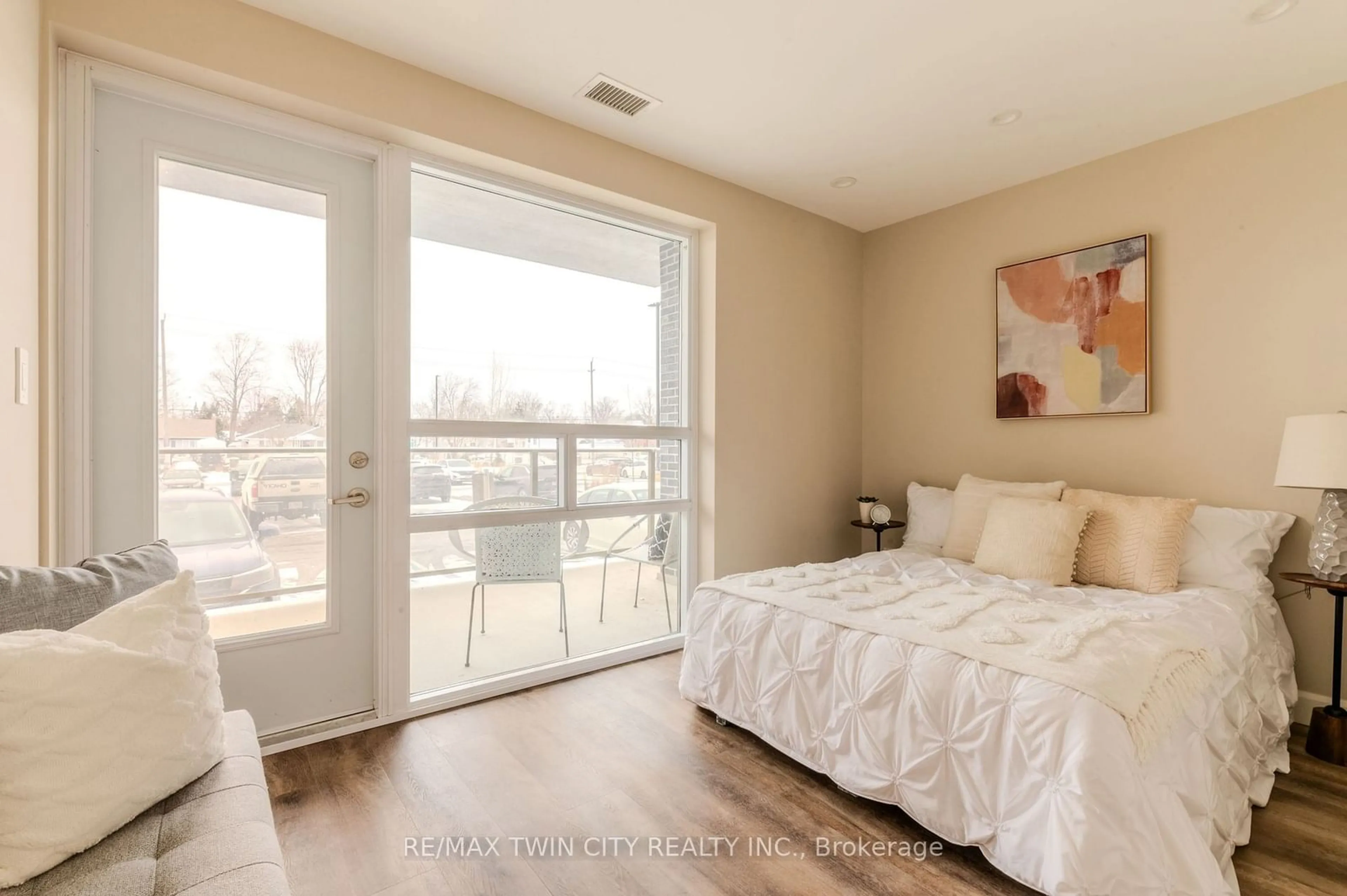 Bedroom with bed, wood/laminate floor for 34 Norman St #101, Brant Ontario N3R 2Y1