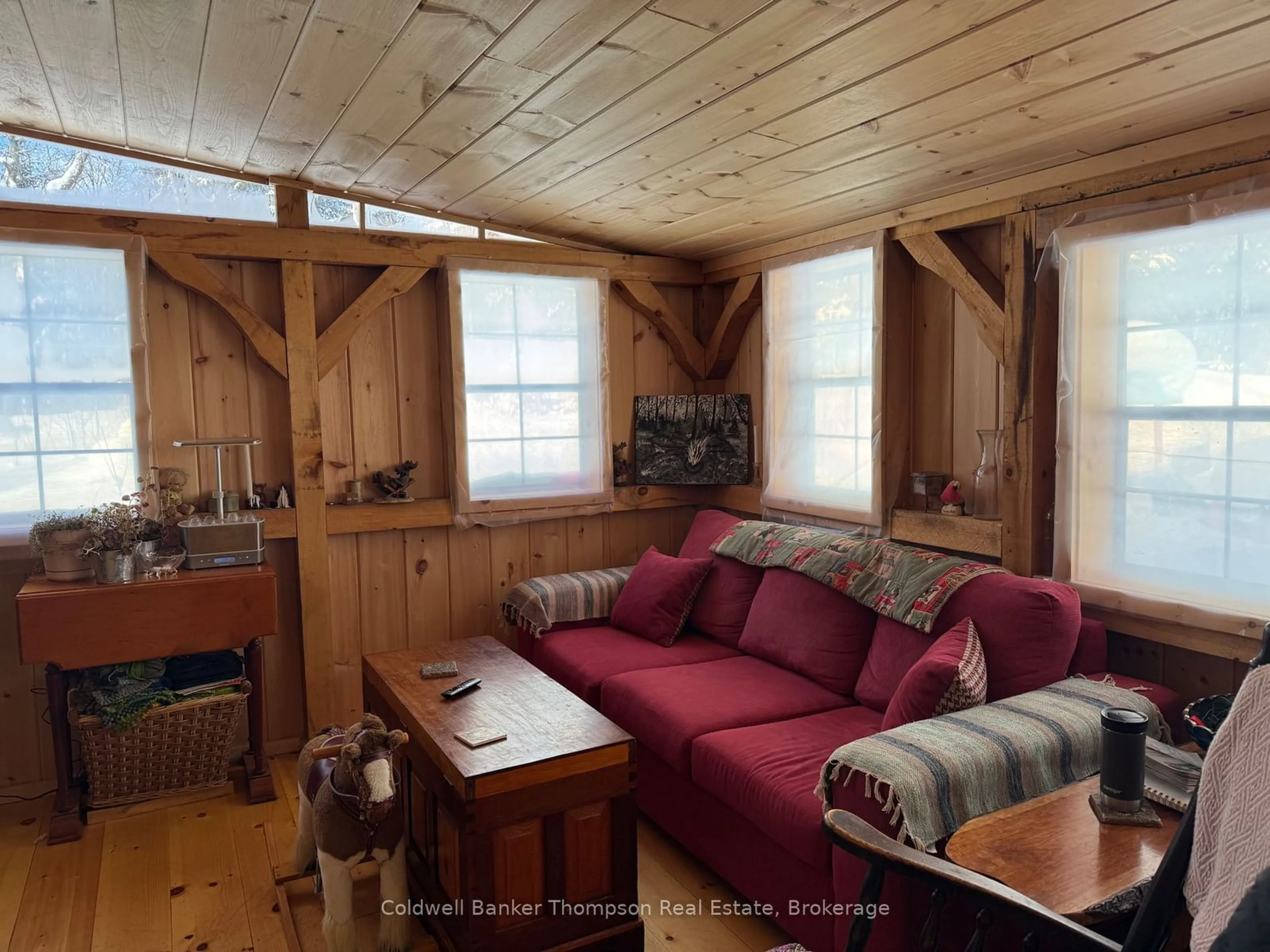 Living room with furniture, wood/laminate floor for 1898 AXE LAKE Rd, McMurrich/Monteith Ontario P0A 1Y0
