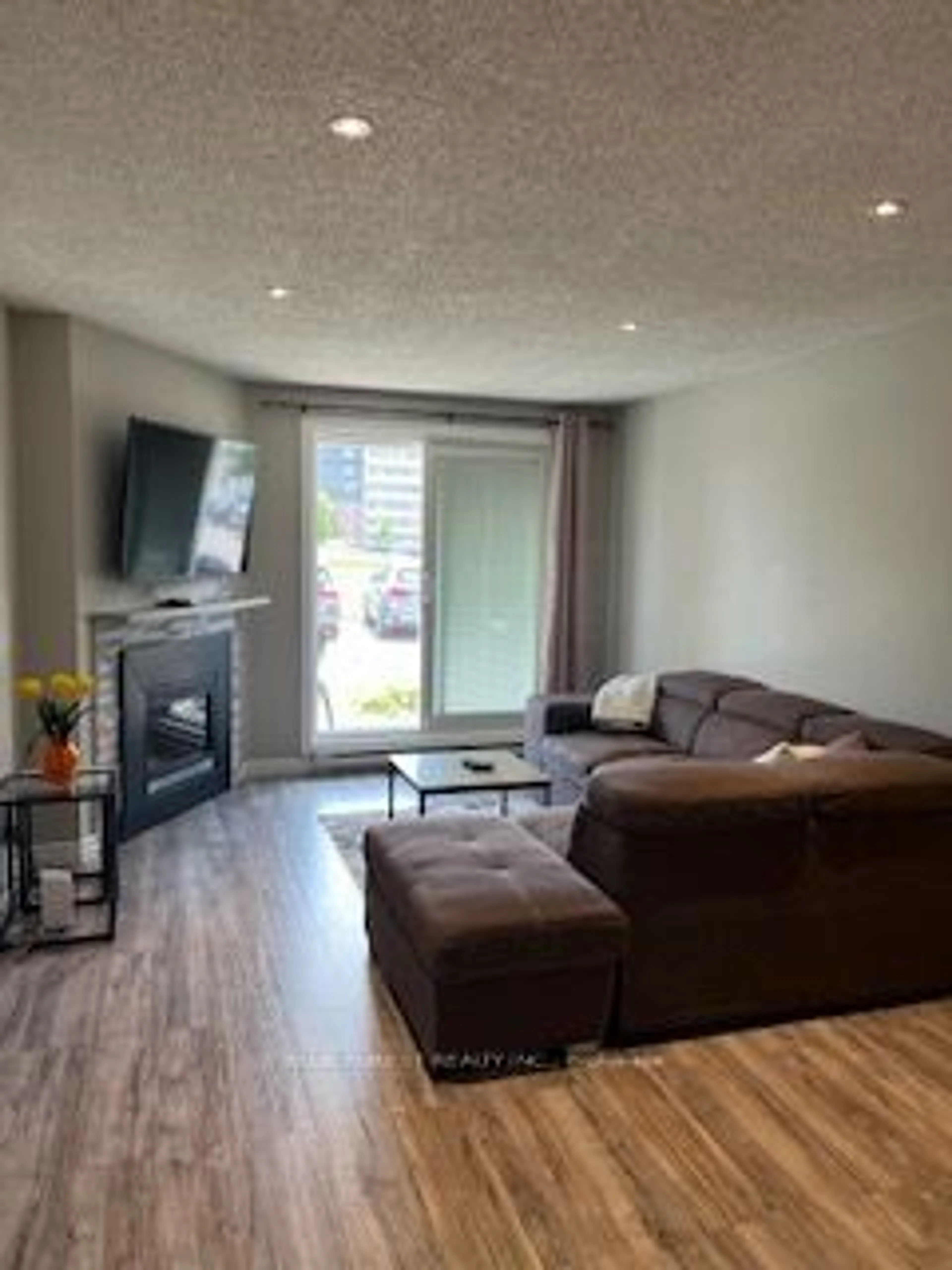 Living room with furniture, wood/laminate floor for 1096 Jalna Blvd #103, London Ontario N6E 3B8