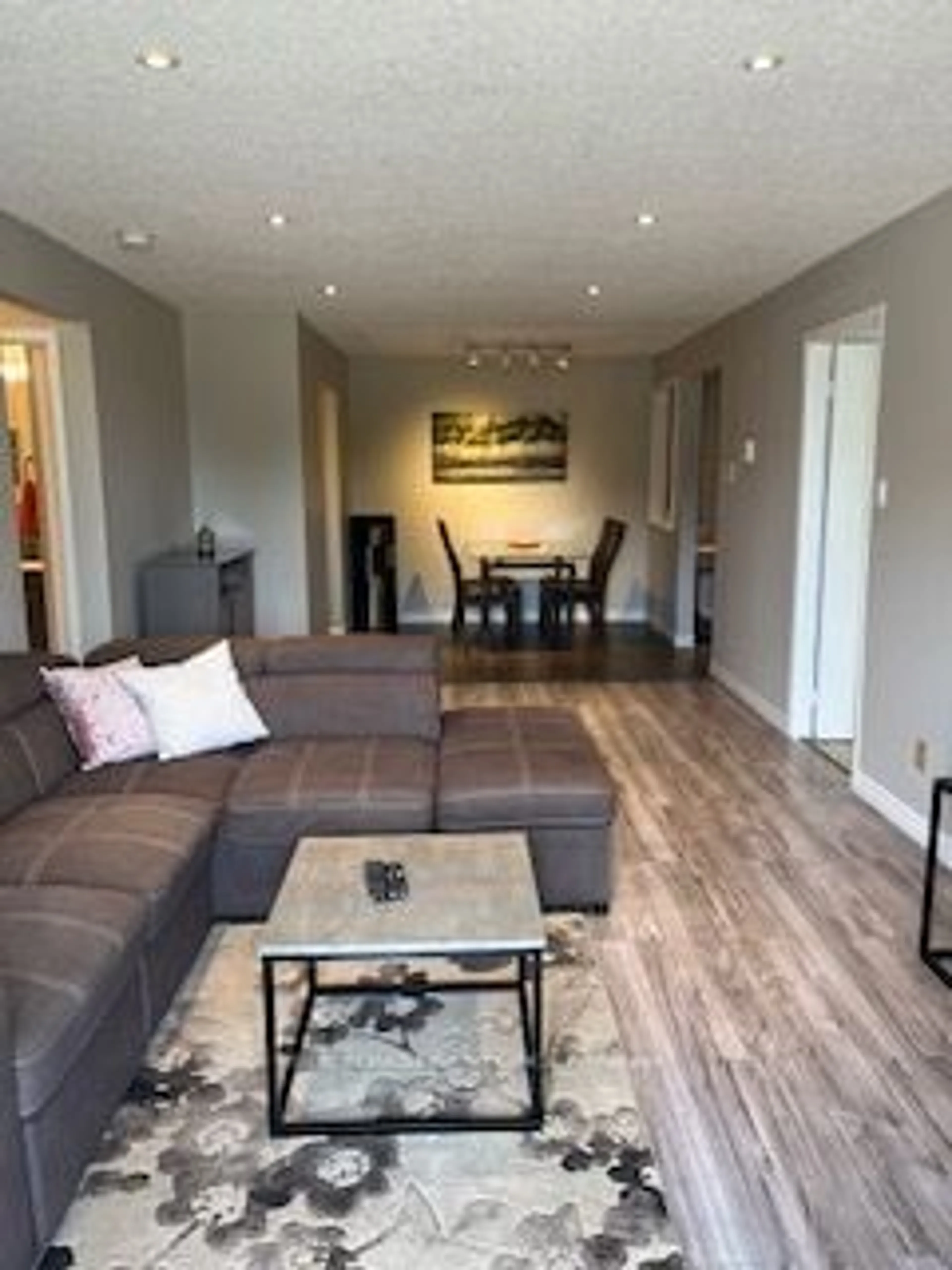 Living room with furniture, wood/laminate floor for 1096 Jalna Blvd #103, London Ontario N6E 3B8