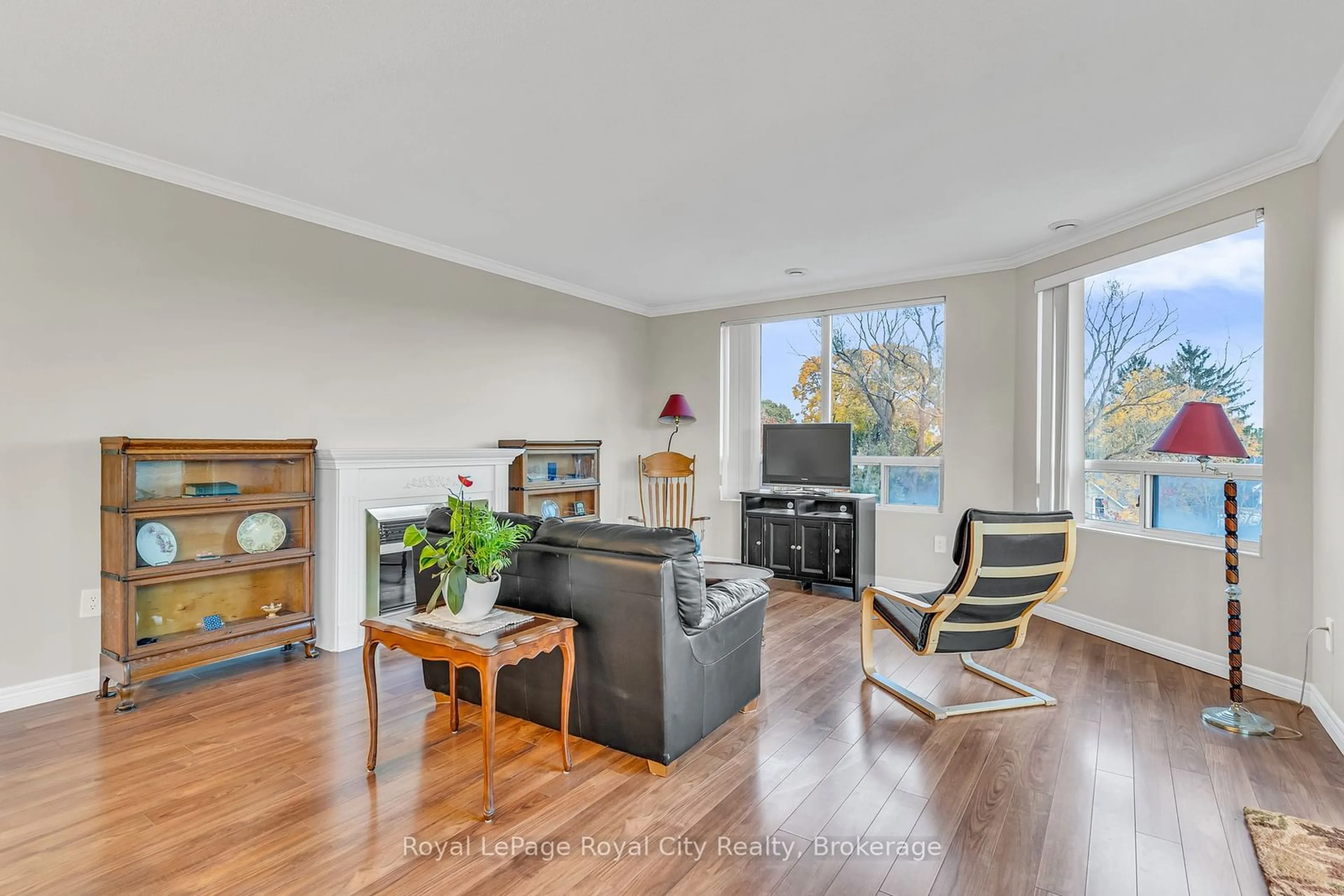 Living room with furniture, wood/laminate floor for 60 WYNDHAM St #311, Guelph Ontario N1E 7H7