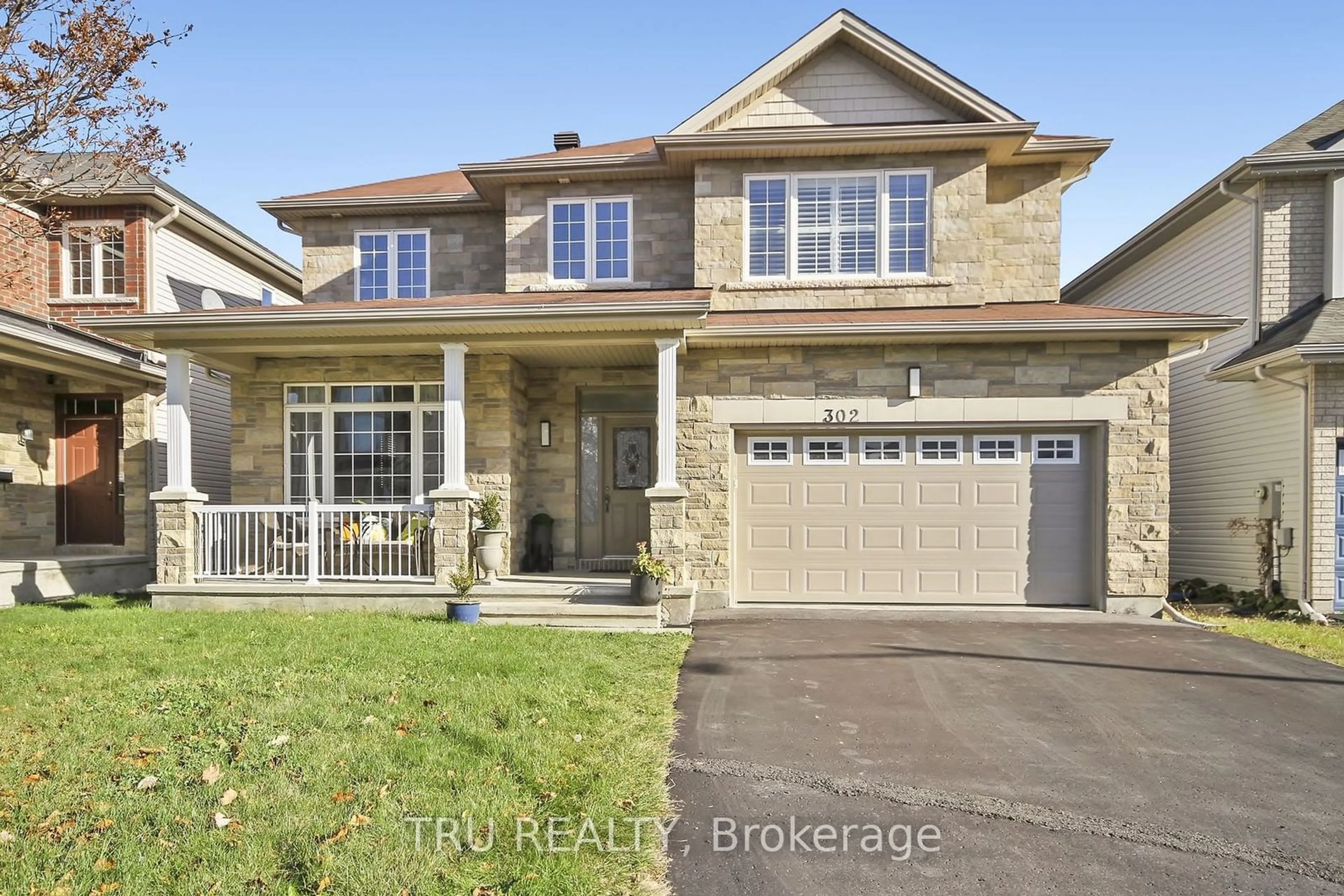 Home with brick exterior material, street for 302 Saddleridge Dr, Orleans - Convent Glen and Area Ontario K1W 0C1