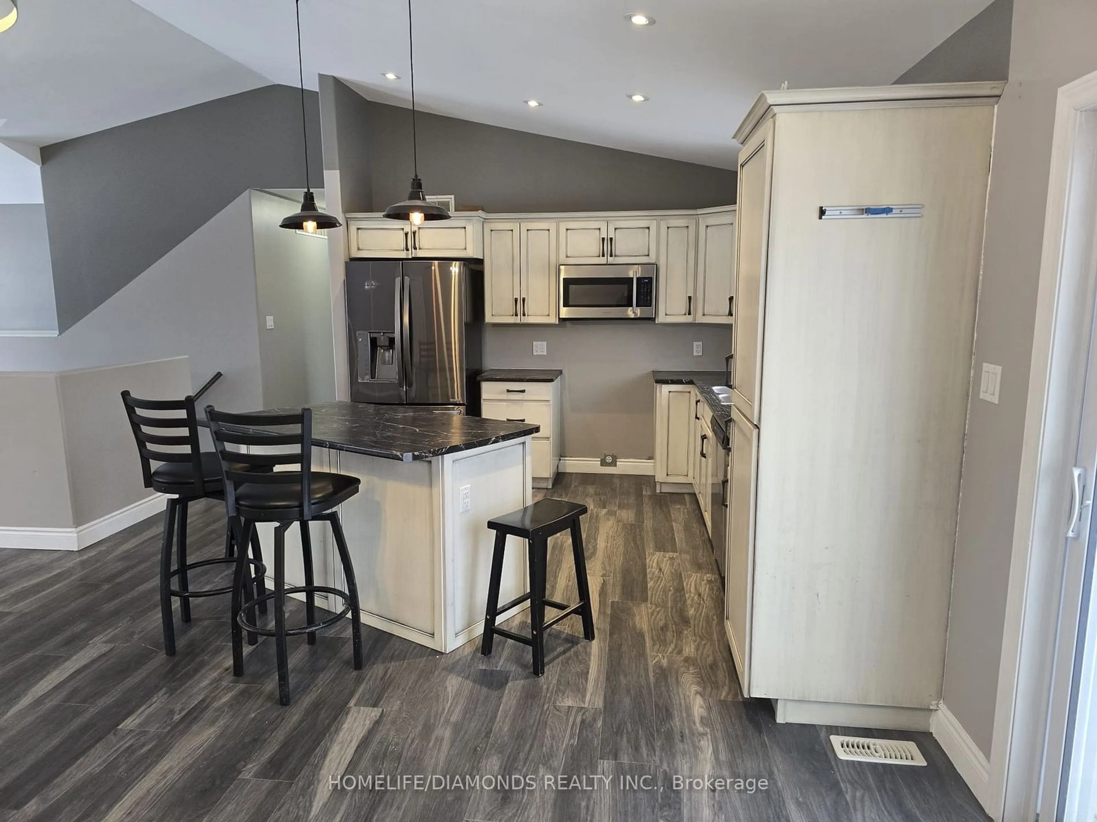 Open concept kitchen, wood/laminate floor for 136 Fitzgerald Rd, Quinte West Ontario K8V 0B1