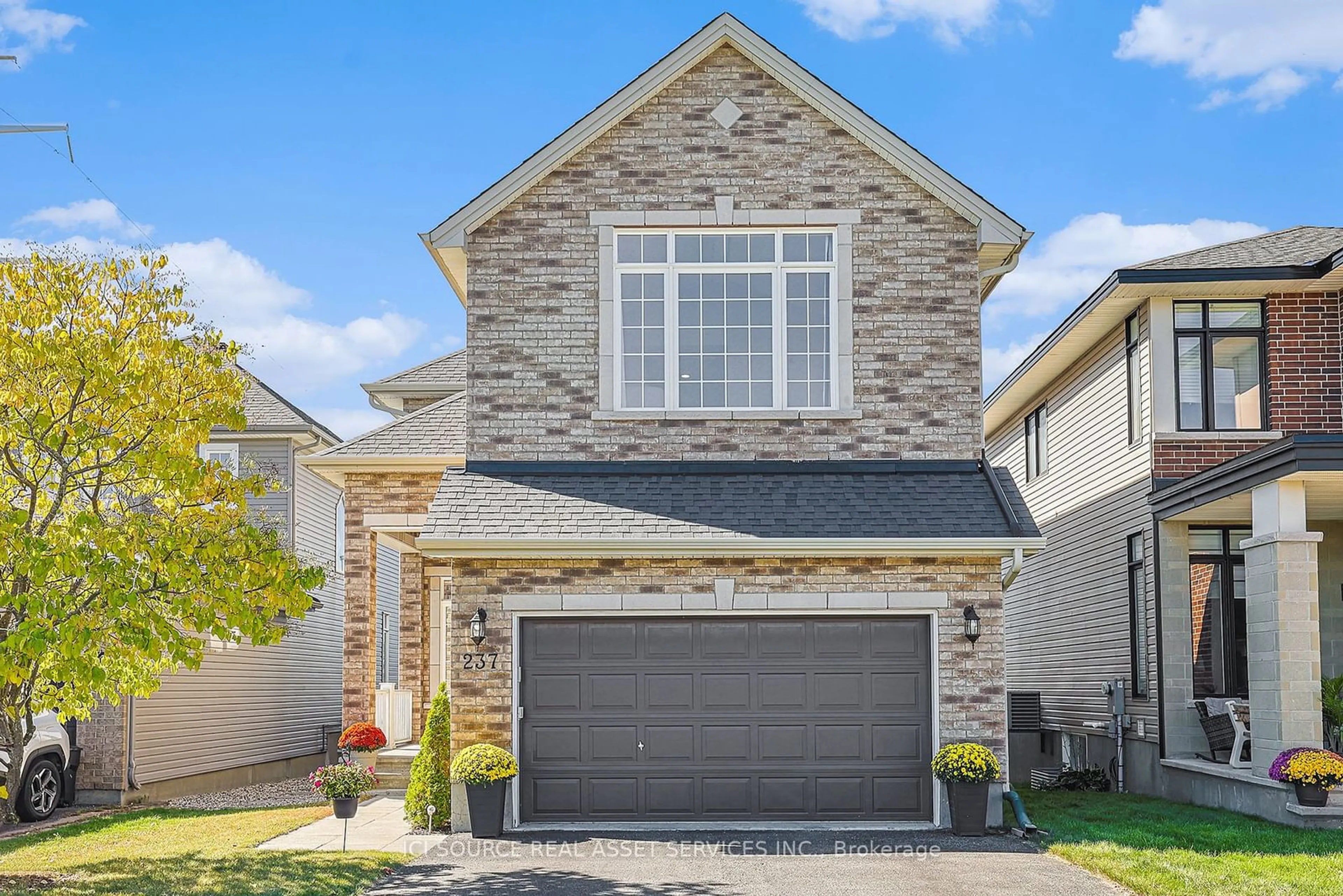 Home with brick exterior material, street for 237 Bridgestone Dr, Kanata Ontario K2M 0C5