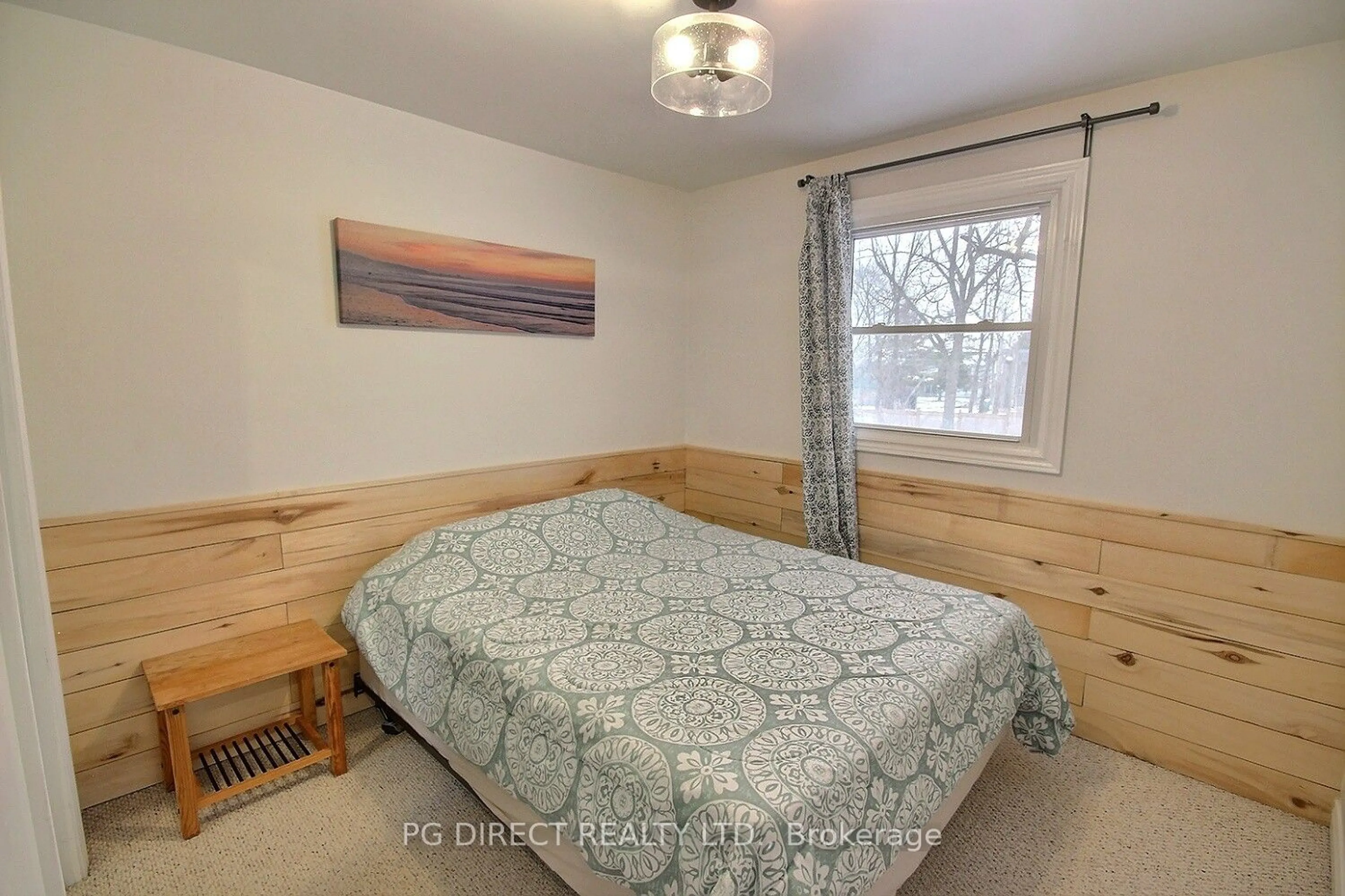 Bedroom with bed, wood/laminate floor for 1310 County Rd 3, Prince Edward County Ontario K0K 1L0