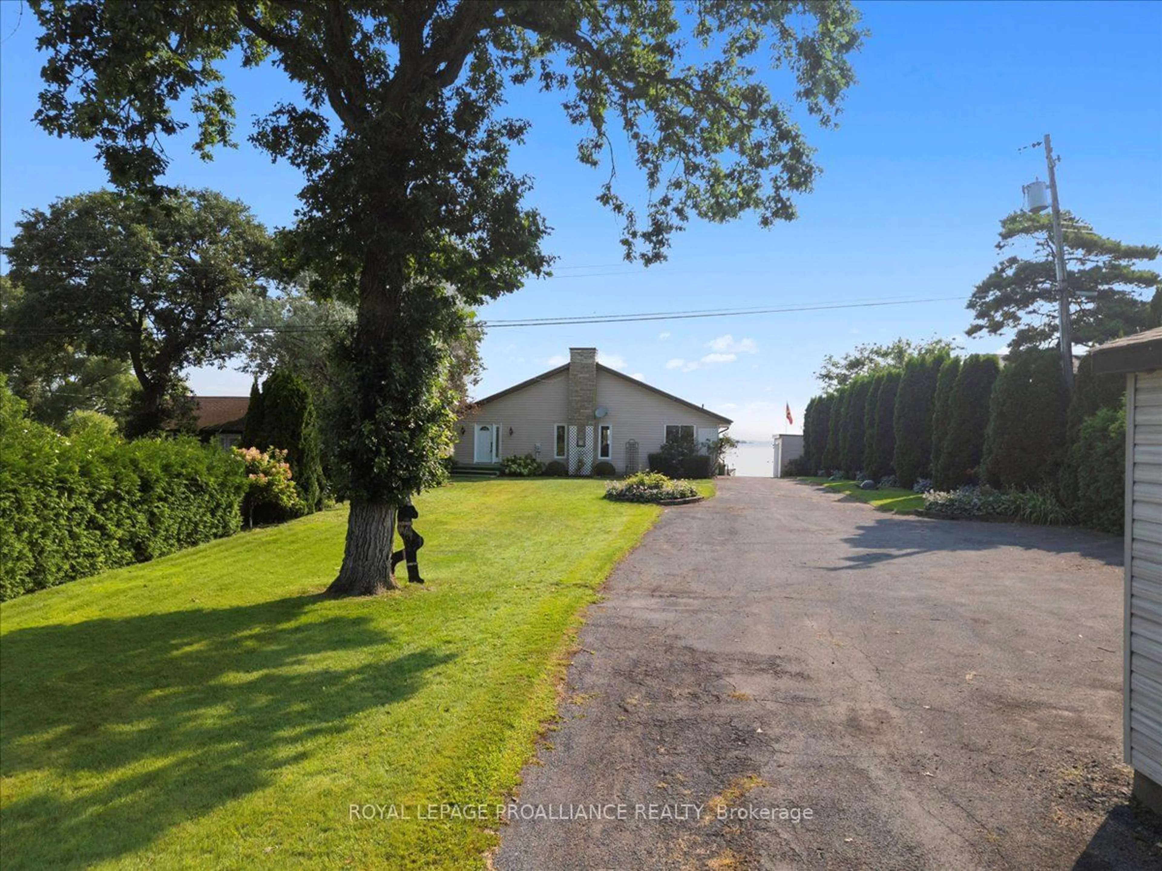 A pic from outside/outdoor area/front of a property/back of a property/a pic from drone, street for 32 Peats Point Lane, Prince Edward County Ontario K8N 4Z7