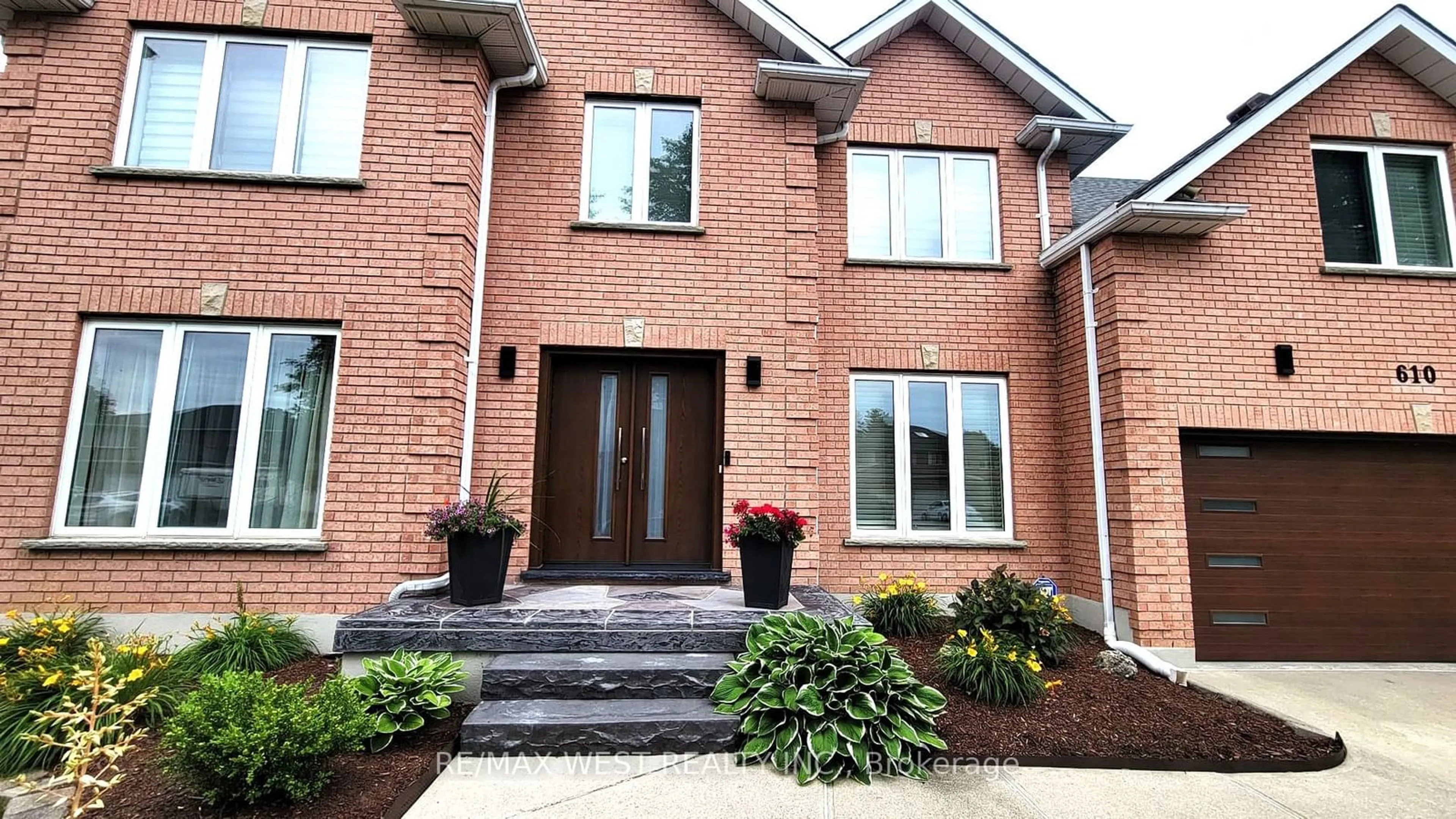 Home with brick exterior material, street for 610 Stonebury Cres, Waterloo Ontario N2K 3R1