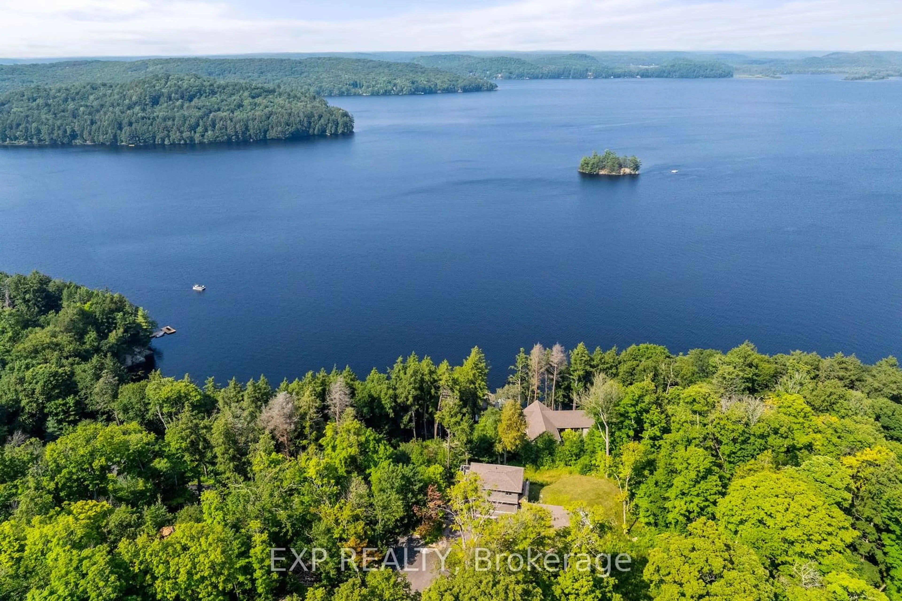 A pic from outside/outdoor area/front of a property/back of a property/a pic from drone, water/lake/river/ocean view for 124 Claren Cres, Huntsville Ontario P1H 2J2