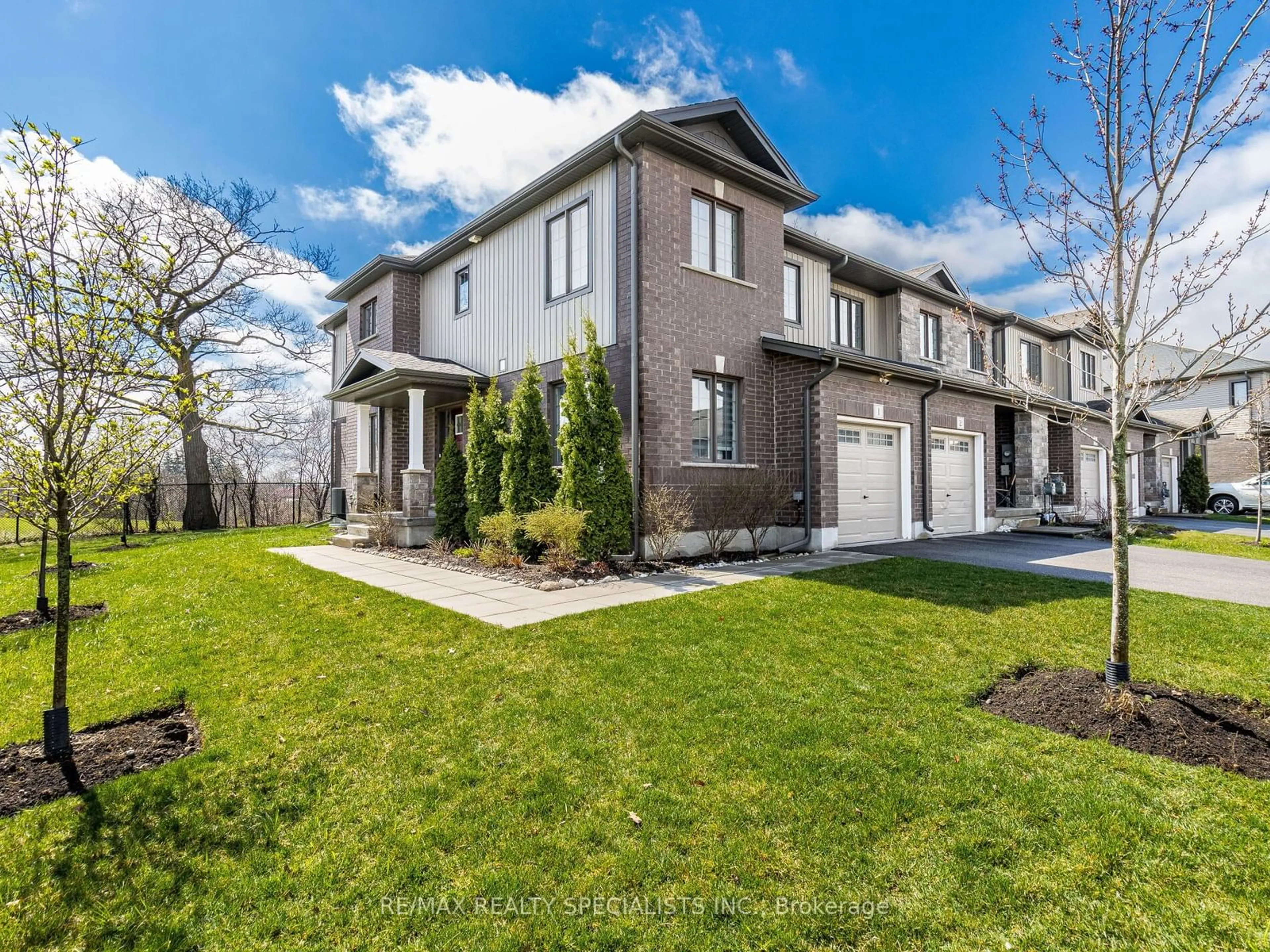 A pic from outside/outdoor area/front of a property/back of a property/a pic from drone, street for 135 Hardcastle Dr #1, Cambridge Ontario N1S 0B6