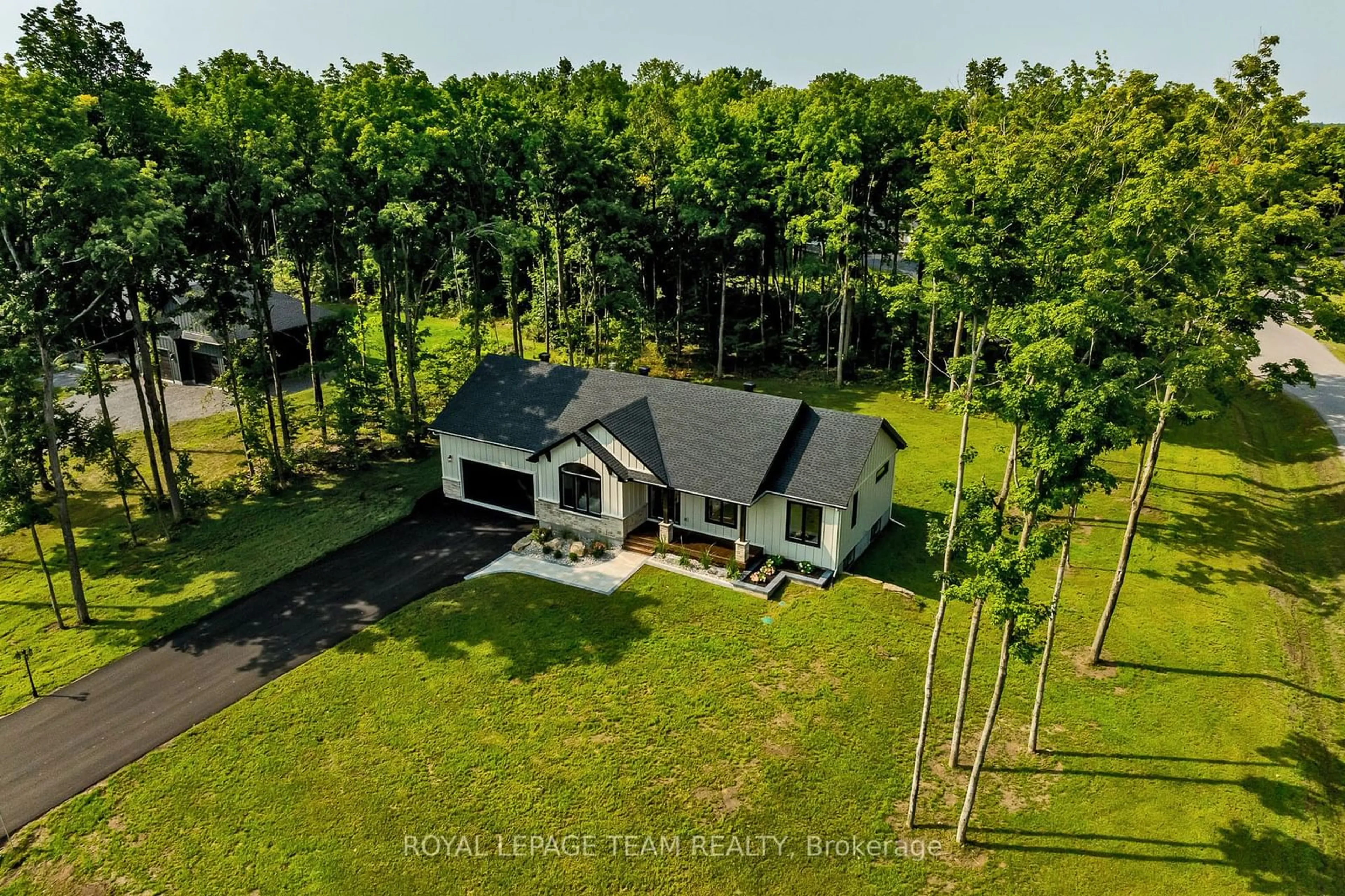 A pic from outside/outdoor area/front of a property/back of a property/a pic from drone, water/lake/river/ocean view for 5 Comeau Crt, North Grenville Ontario K0G 1J0