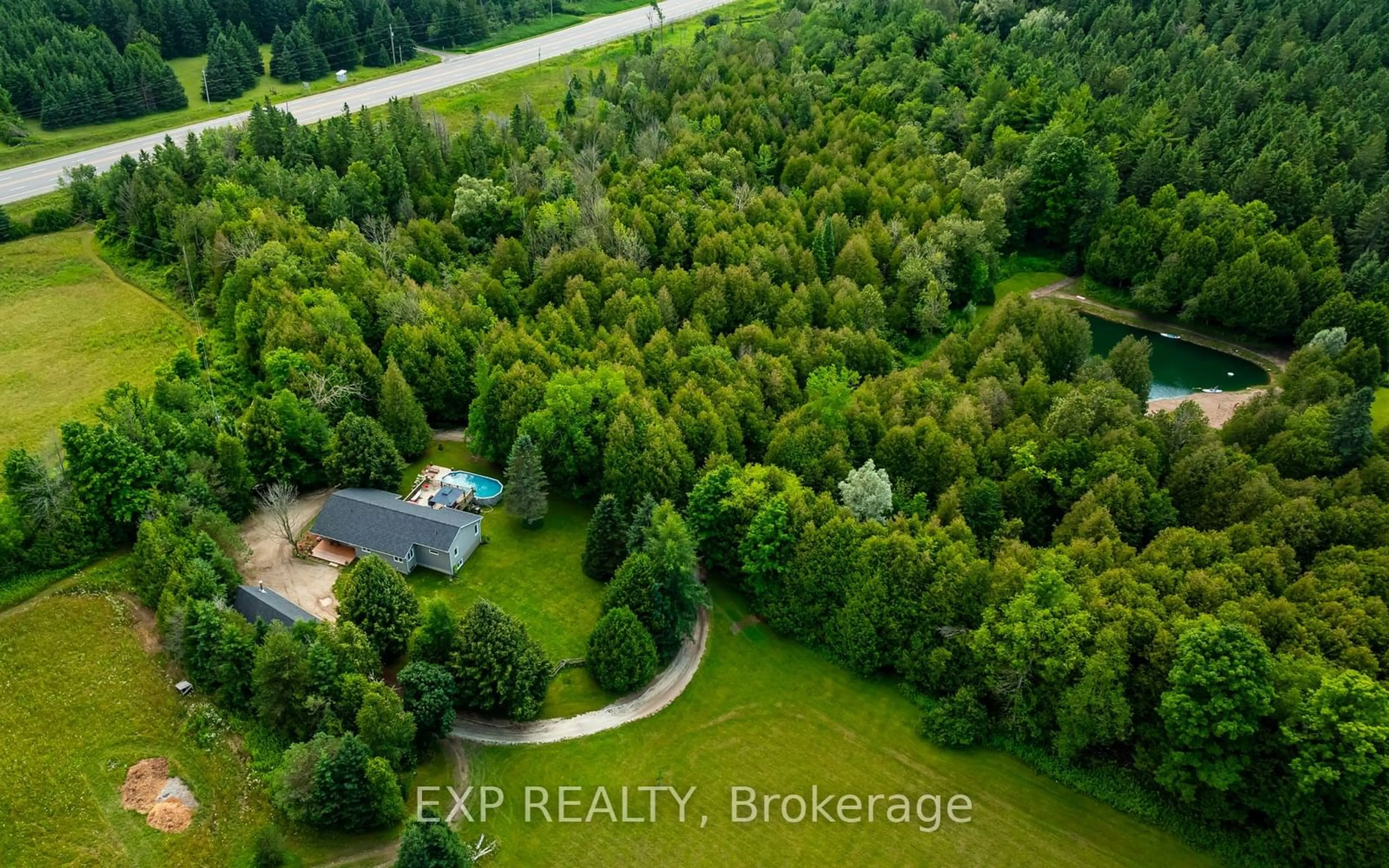 A pic from outside/outdoor area/front of a property/back of a property/a pic from drone, forest/trees view for 506097 Highway 89, Mulmur Ontario L9V 0N6